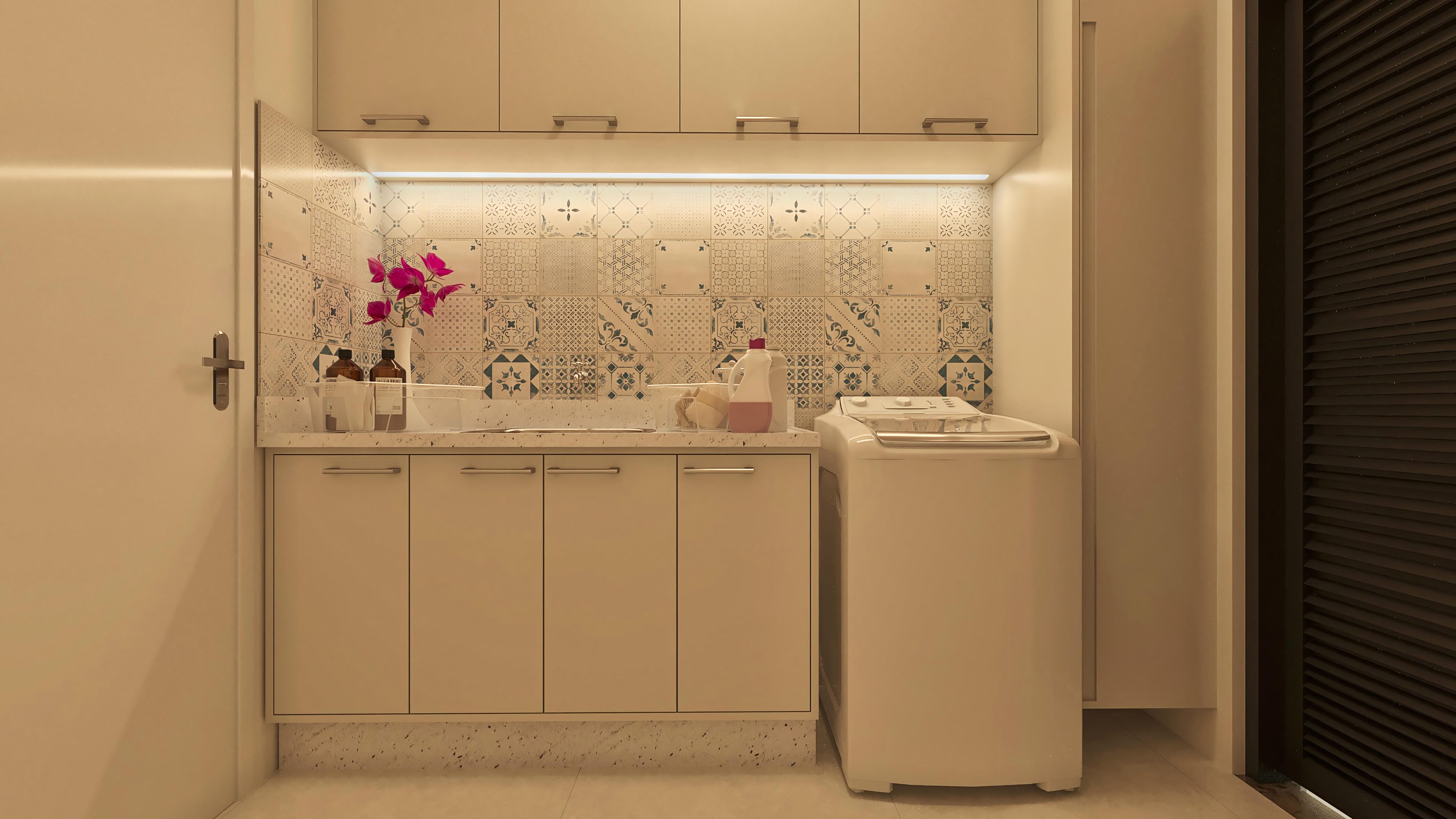 Modern service area with light custom cabinets, granite countertop with sink, decorative tiles on the wall, and a white washing machine.