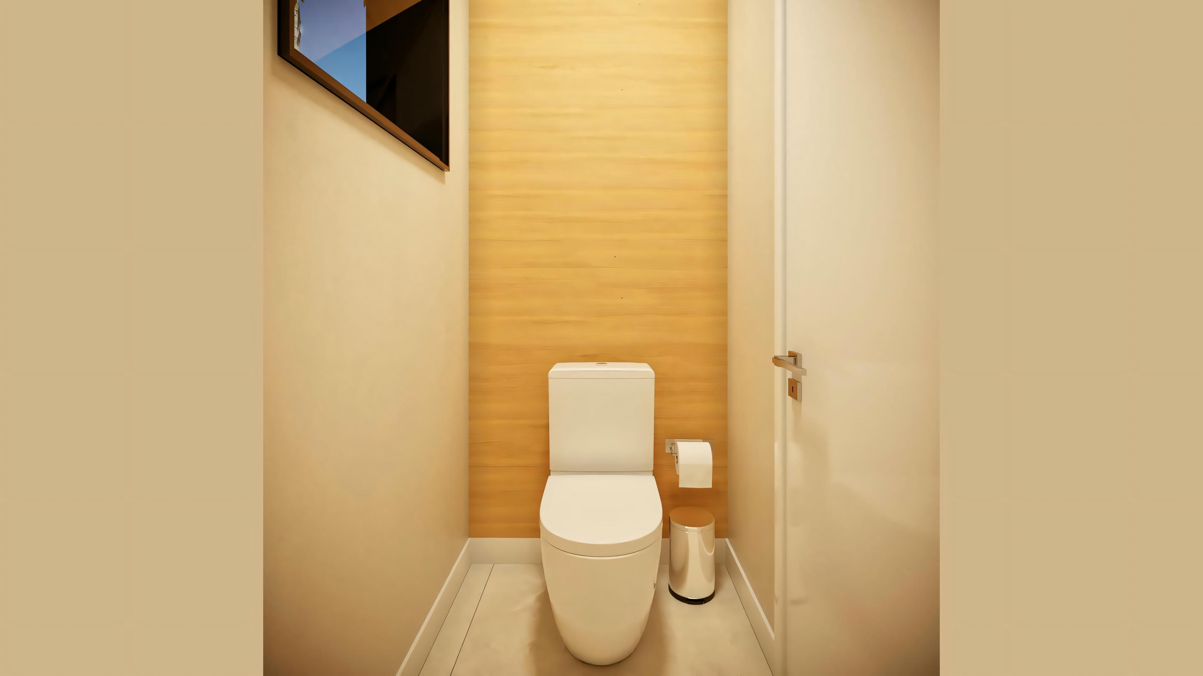Un baño con inodoro y panel de madera en la pared.