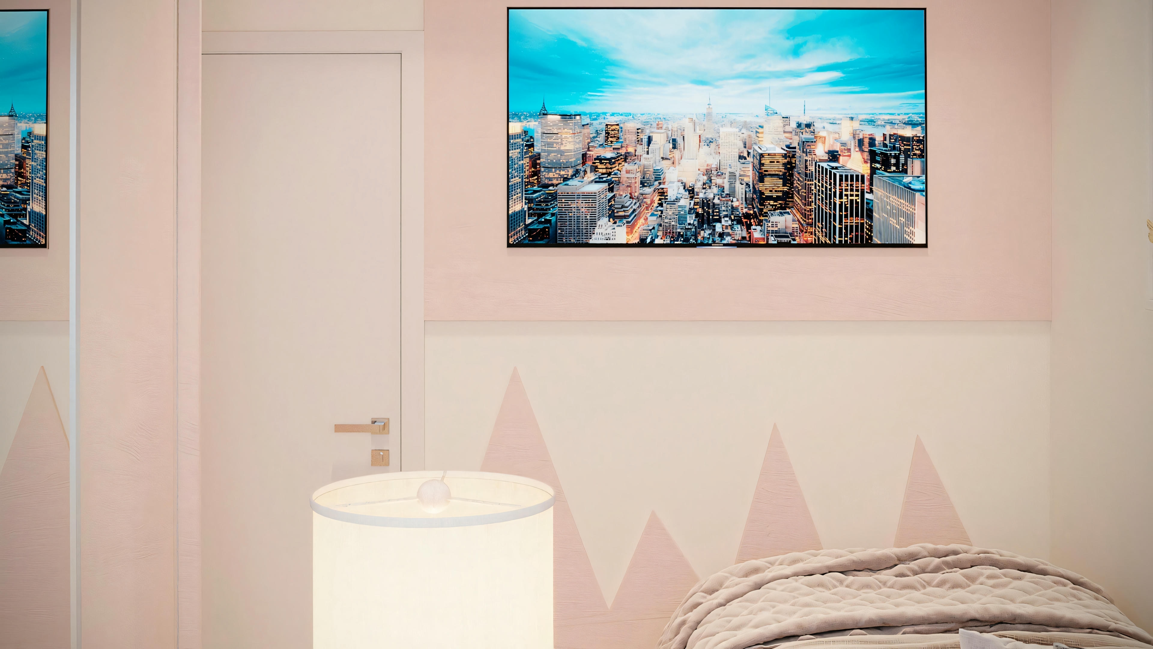An interior space with a bed and a painting above it.