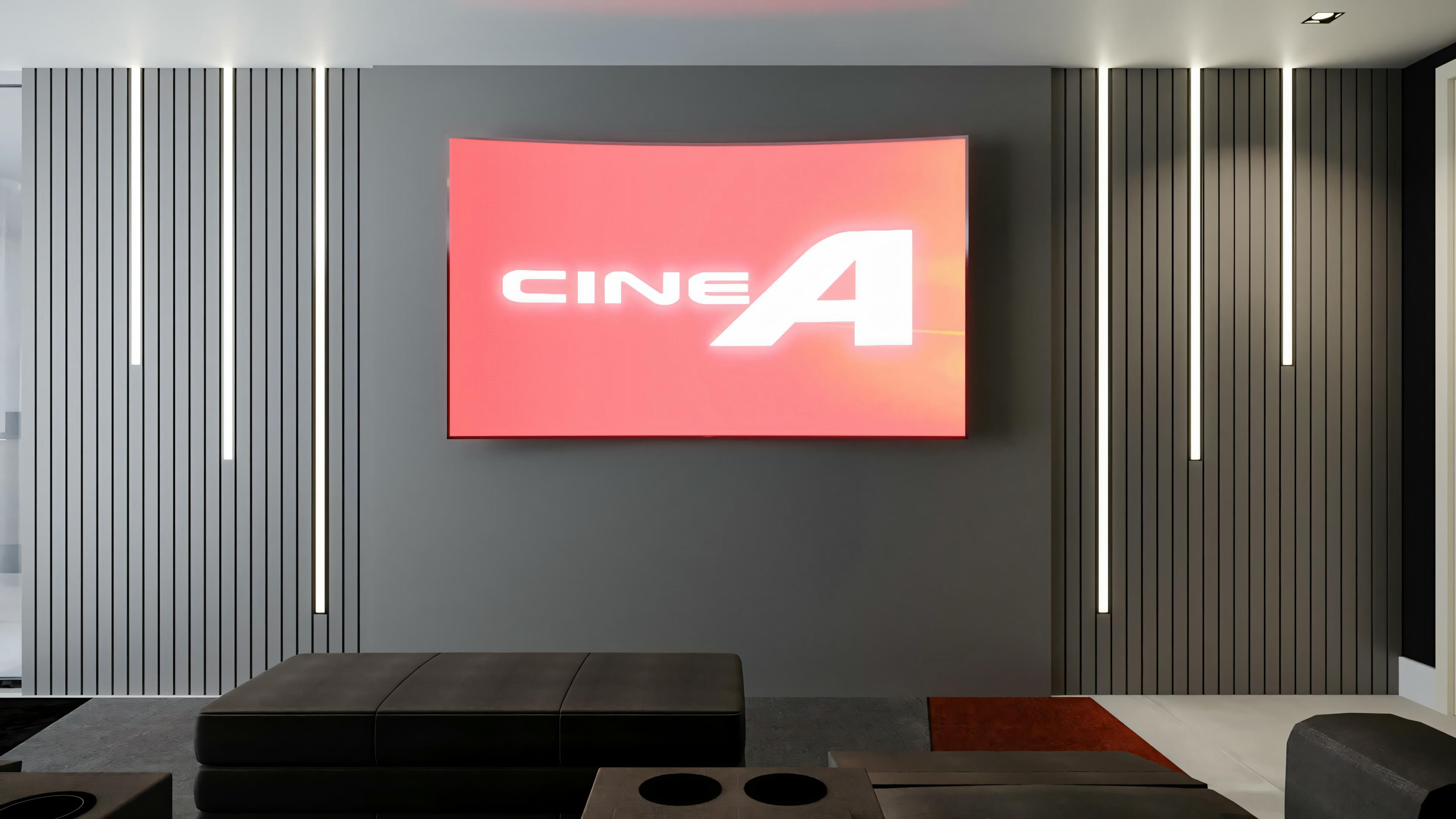 A home theater room with dark-toned seating facing a large screen displaying the text “CINE A”.