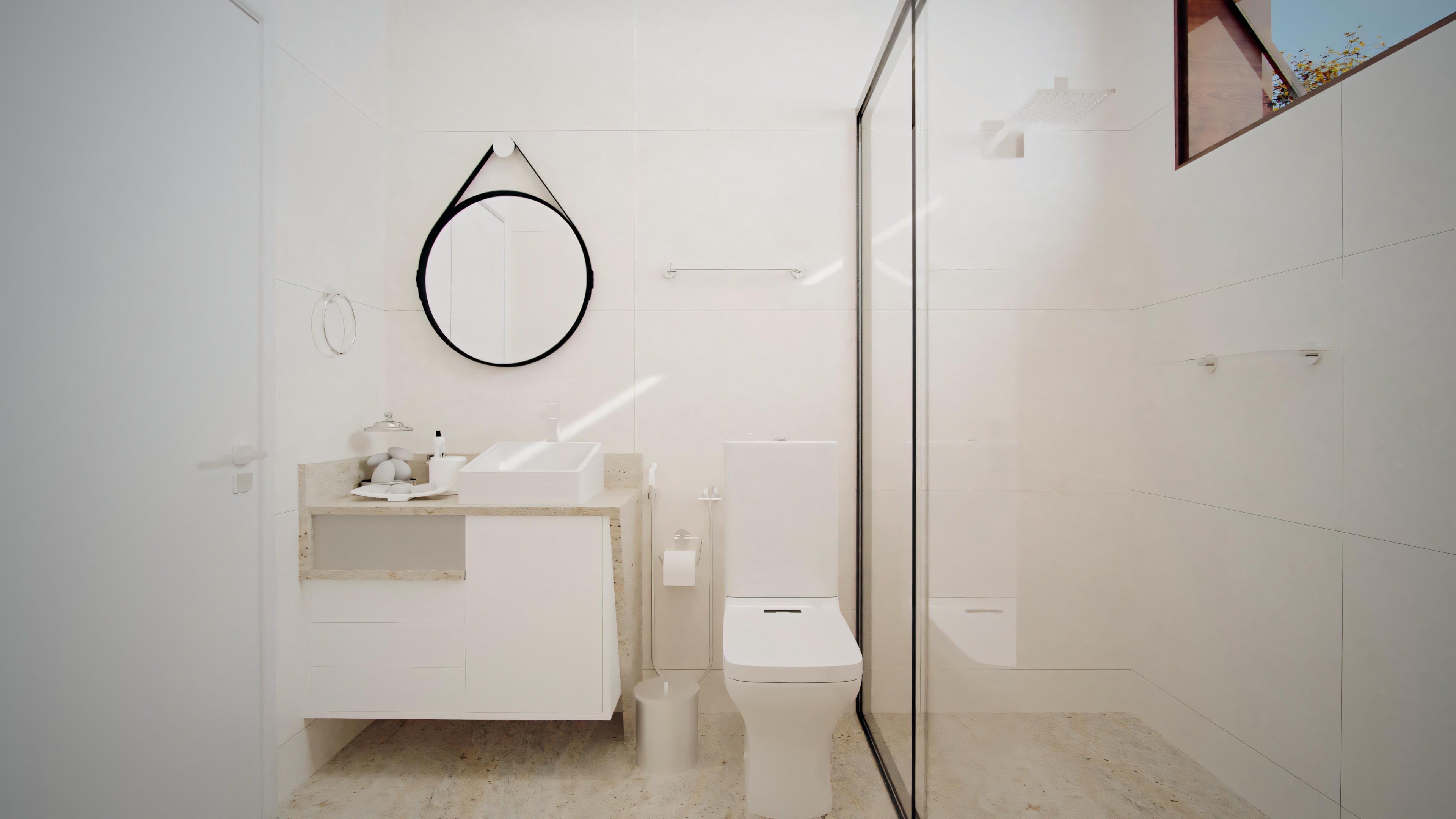 A bathroom with white walls, a sink, a mirror above the sink, and a glass shower enclosure to the right.