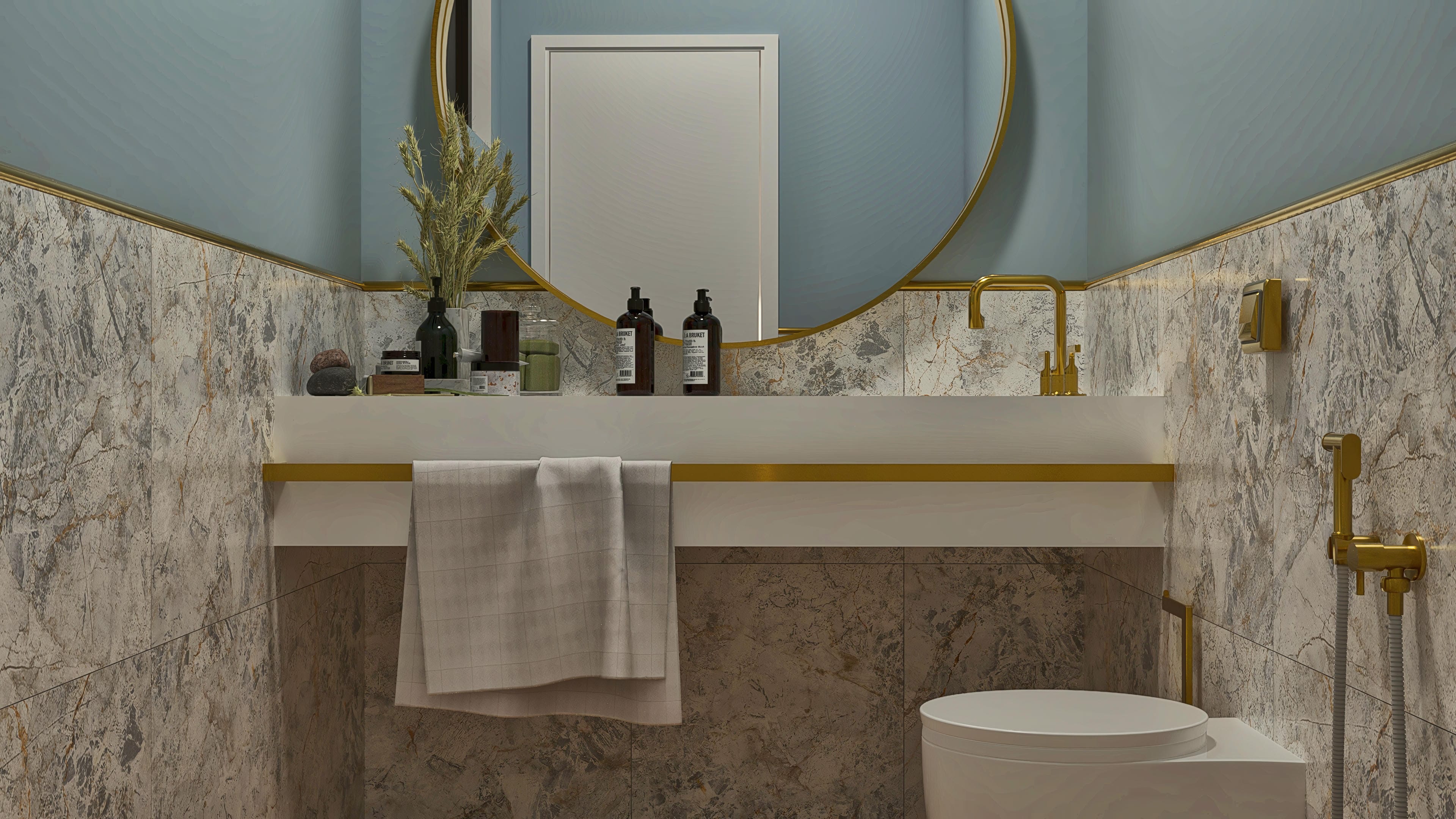 Detail of a modern bathroom with porcelain tile cladding imitating marble in gray and brown tones, white countertop with gold finish, and a round mirror.