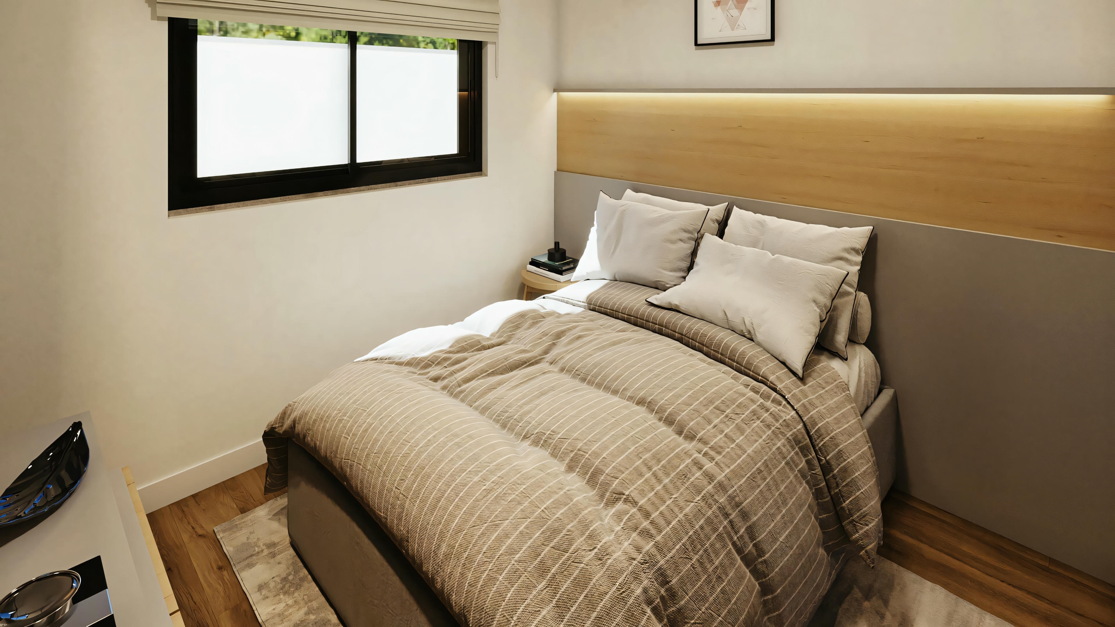 Bedroom with striped bedding, pillows, and side table.