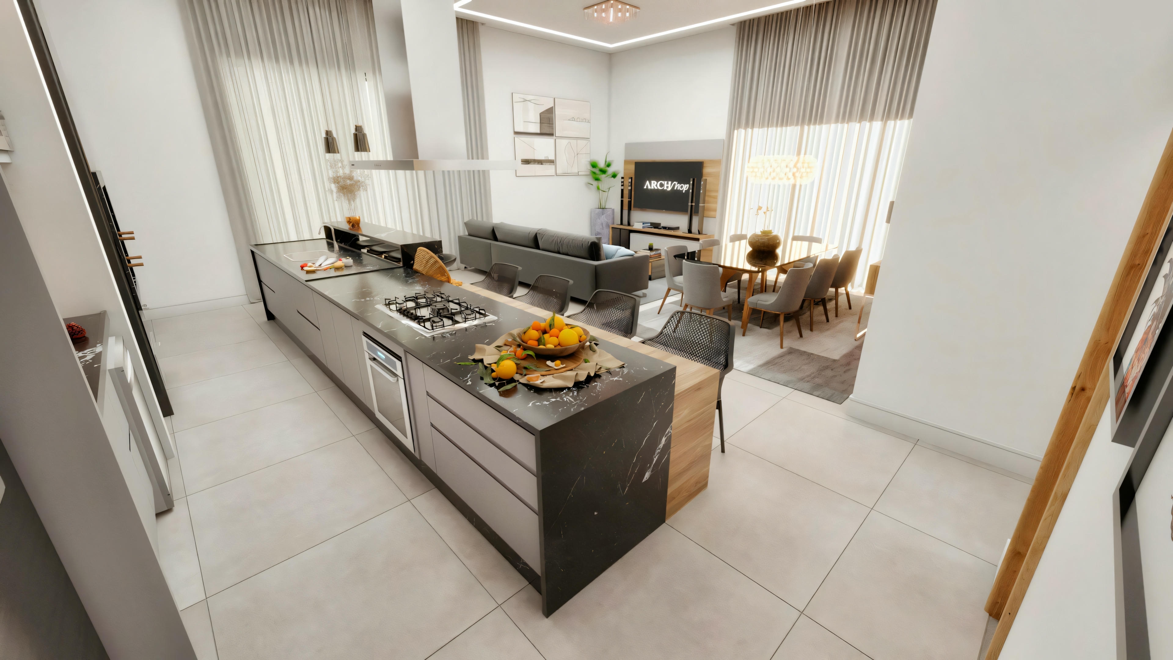 Kitchen integrated with the living and dining room with a central island in a country house, featuring an open-plan concept and natural lighting.