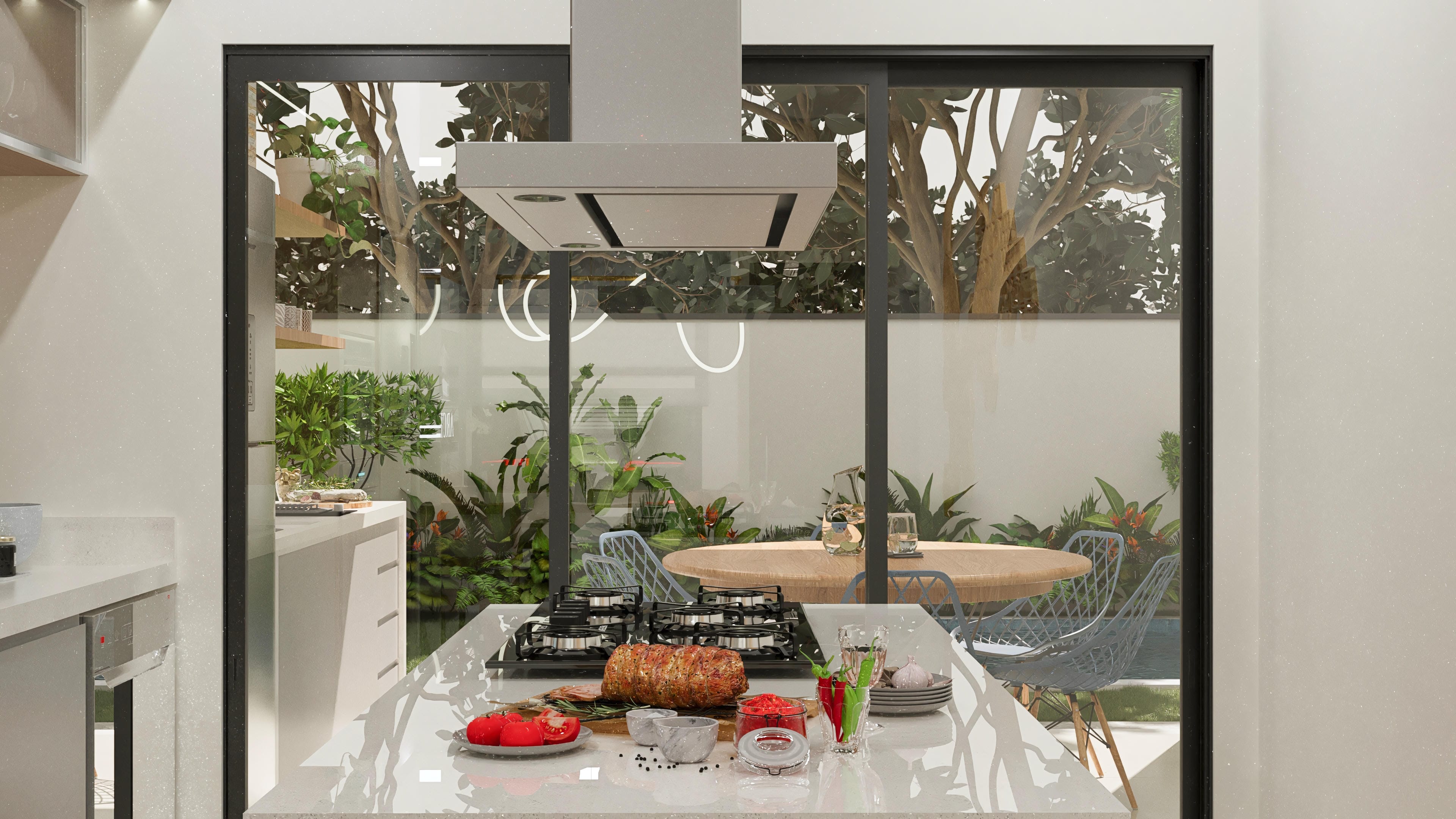 Cocina moderna con encimera de cuarzo y cocina empotrada, integrada al área gourmet con vista al jardín.