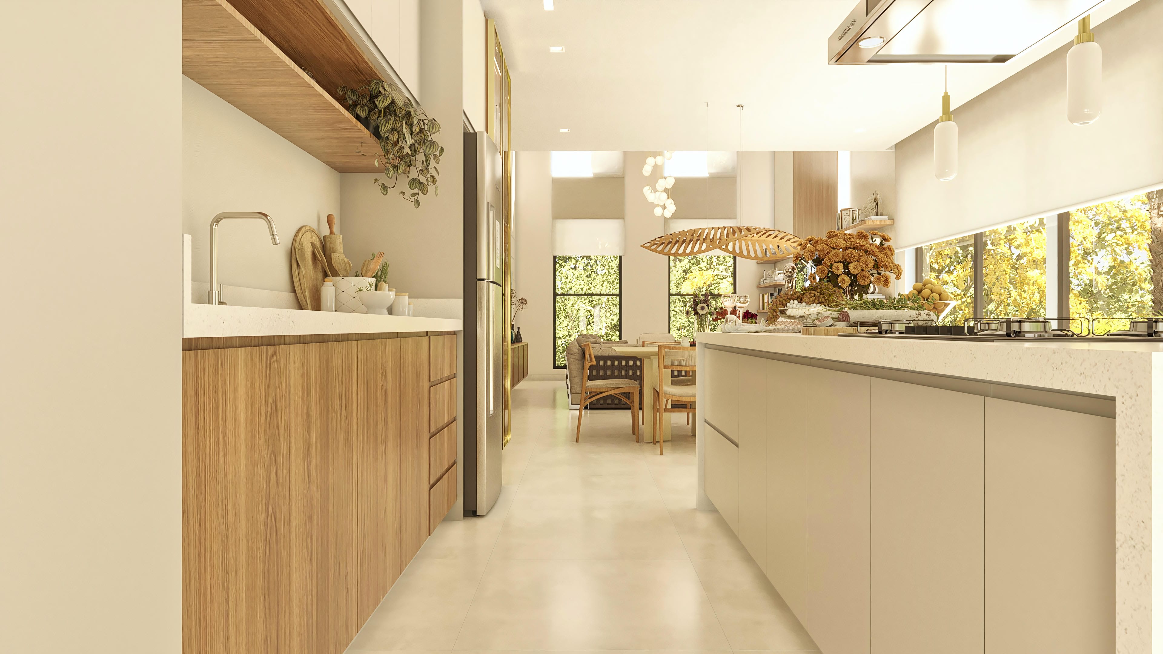 Cocina moderna con isla central y armarios de madera. La iluminación natural entra por las amplias ventanas, integrando el espacio al área de comedor.