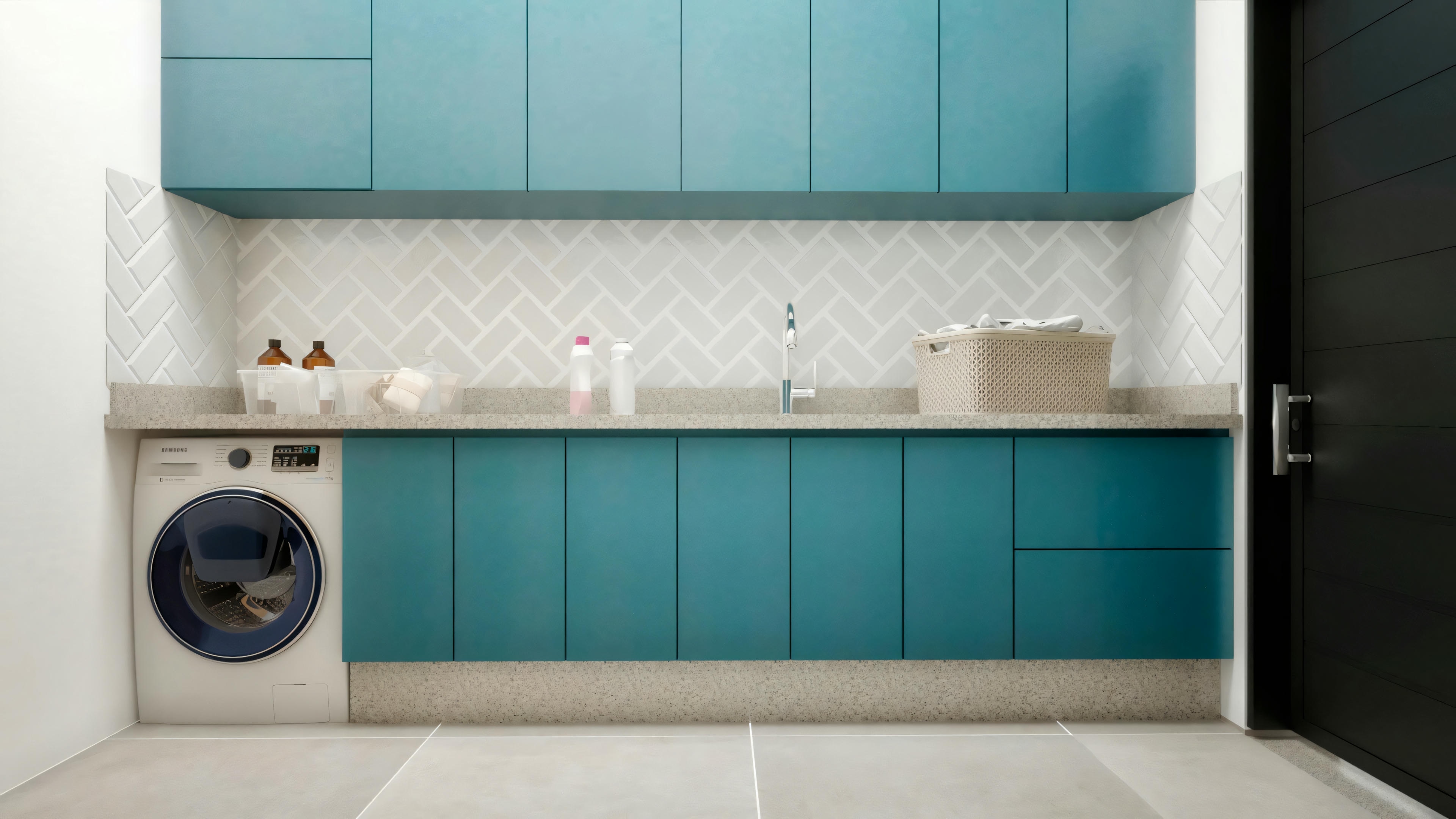 Functional service area in a country house with planned cabinets in blue tones, light countertop, and washing machine.