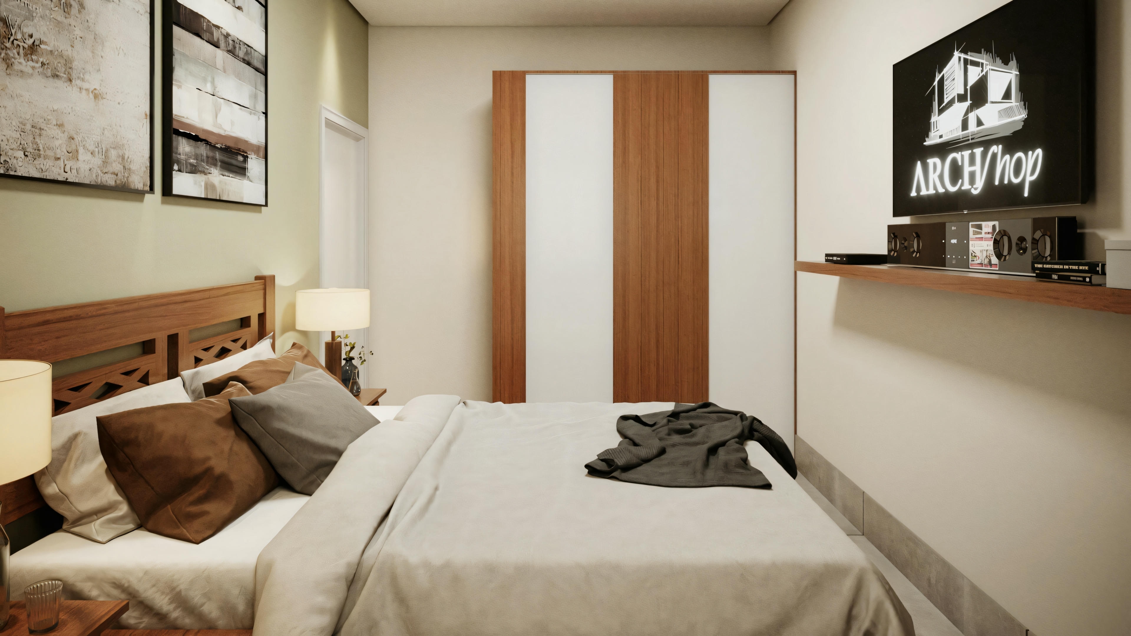 Dormitorio con cama hecha, mesas auxiliares y obras de arte enmarcadas en la pared.