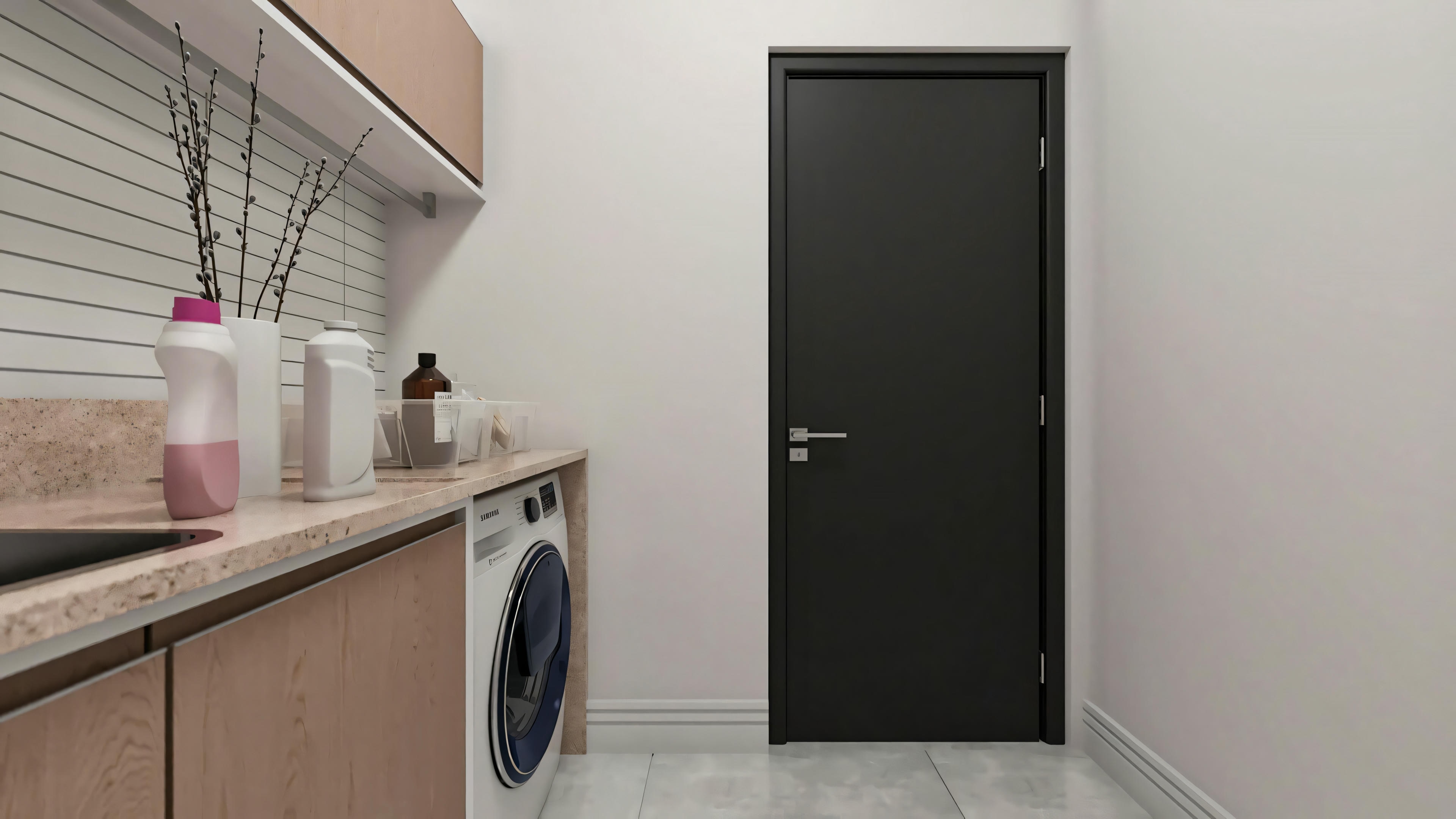Functional and planned laundry room in a 194.7m² two-story house built on a 10x25 plot. Environment with light countertop, wood-tone cabinets, modern washing machine, and black door.
