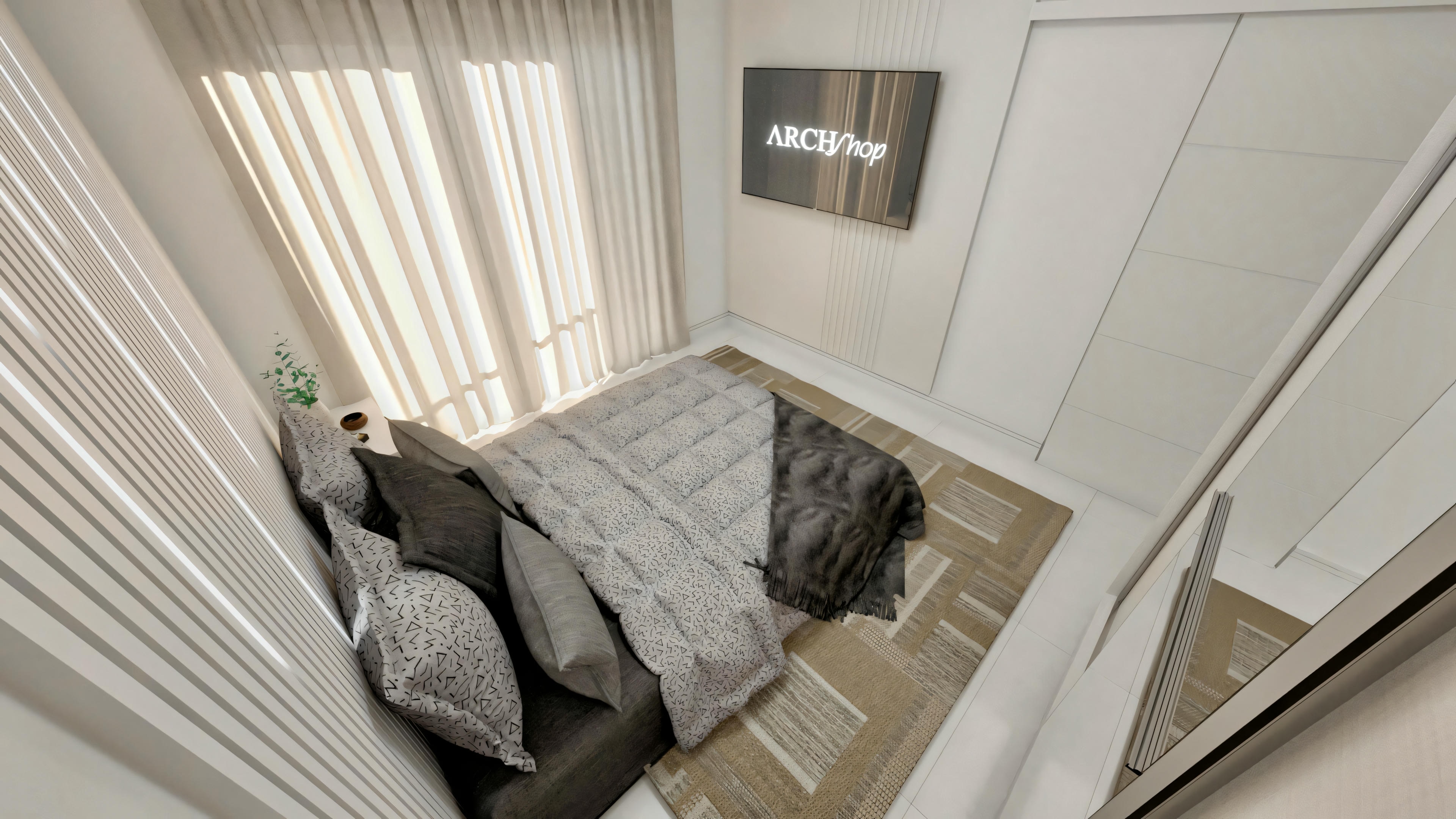 Salón moderno con sofá seccional gris, cojines estampados, alfombra blanca y suelo de madera.