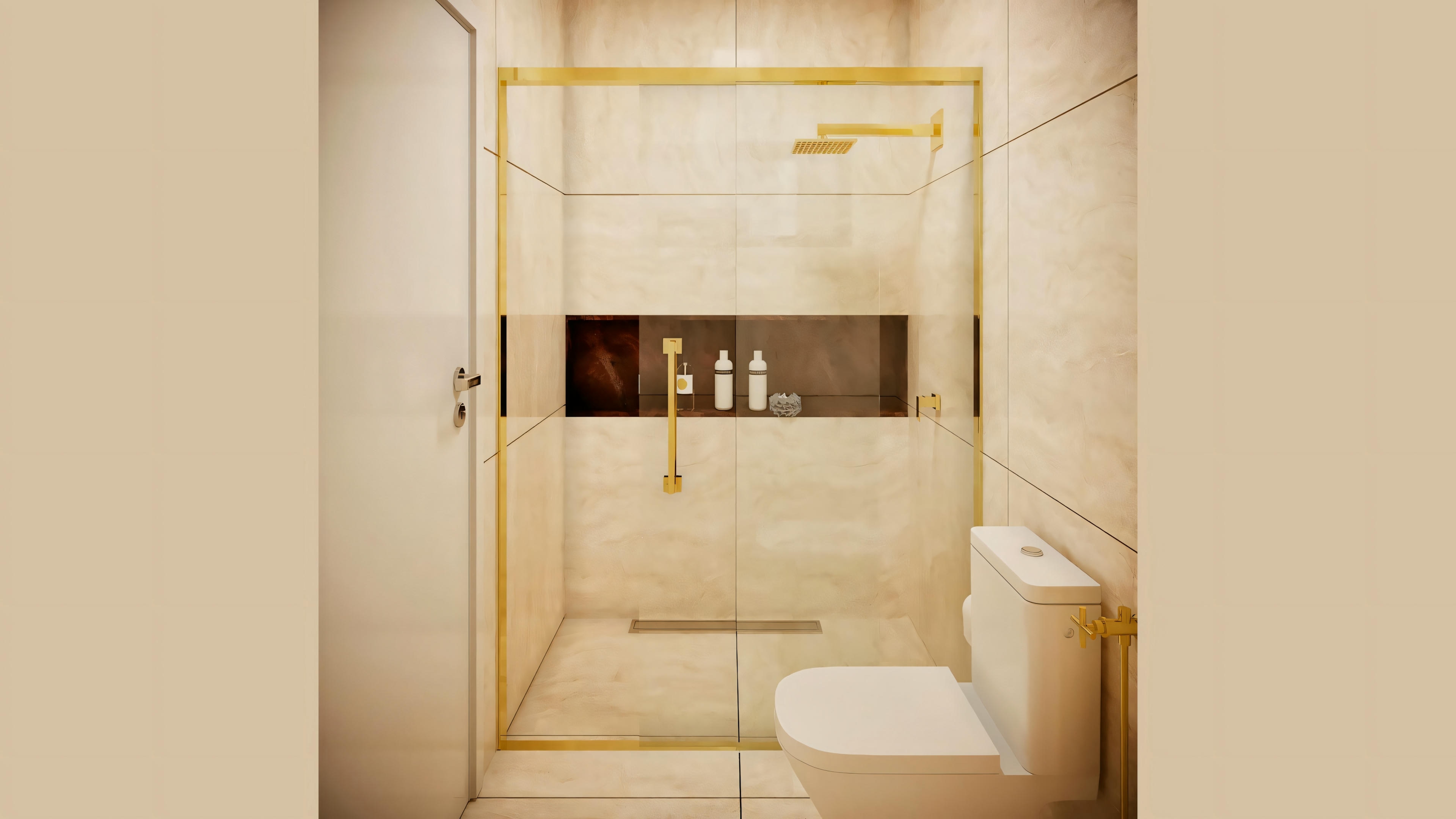 Un baño con azulejos beige, zona de ducha con mampara de cristal y ducha dorada.