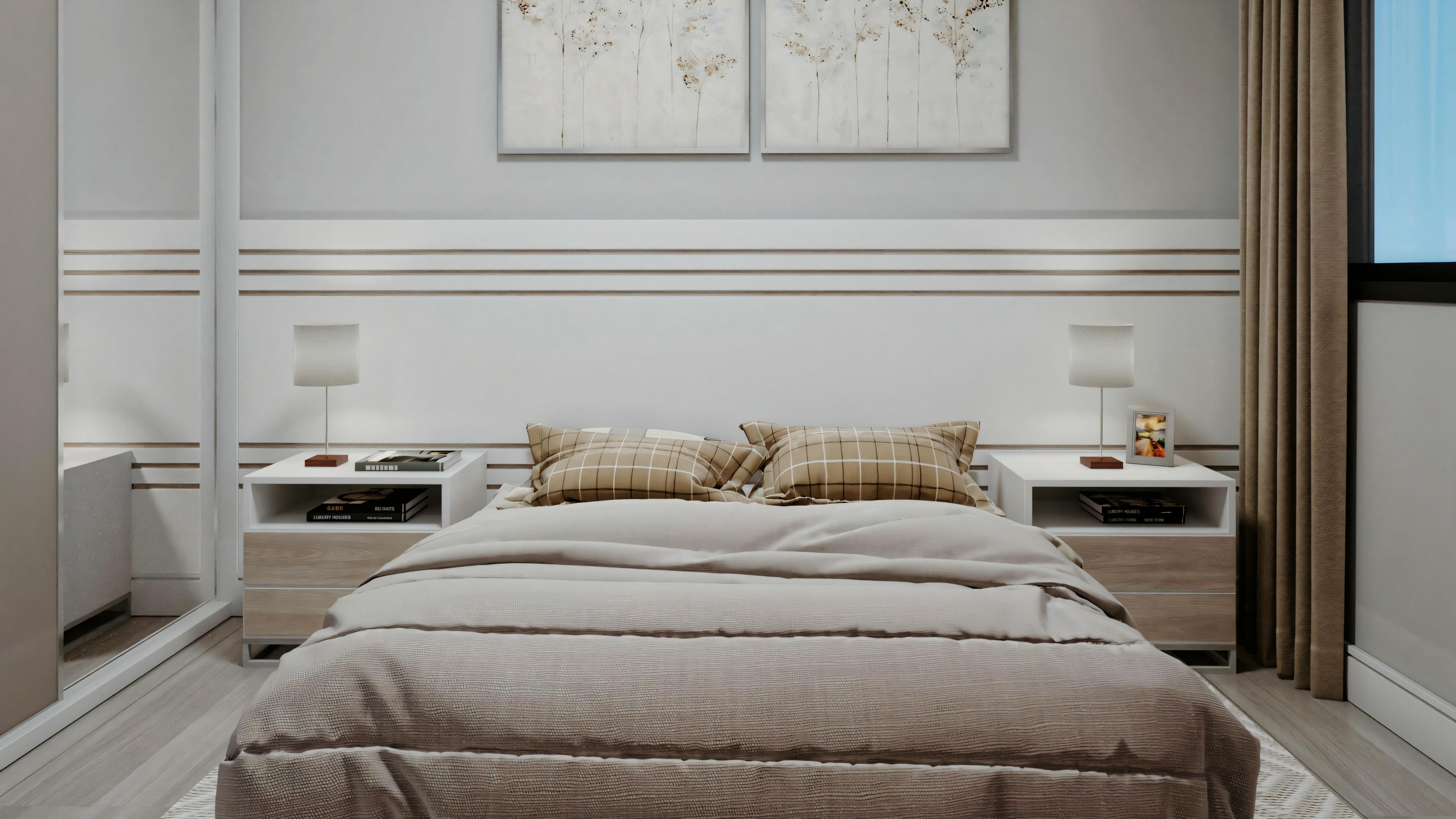 Dormitorio con una cama centralizada, cubierta con edredón y varias almohadas. Hay dos mesas de noche al lado de la cama y una obra de arte enmarcada encima del cabecero.