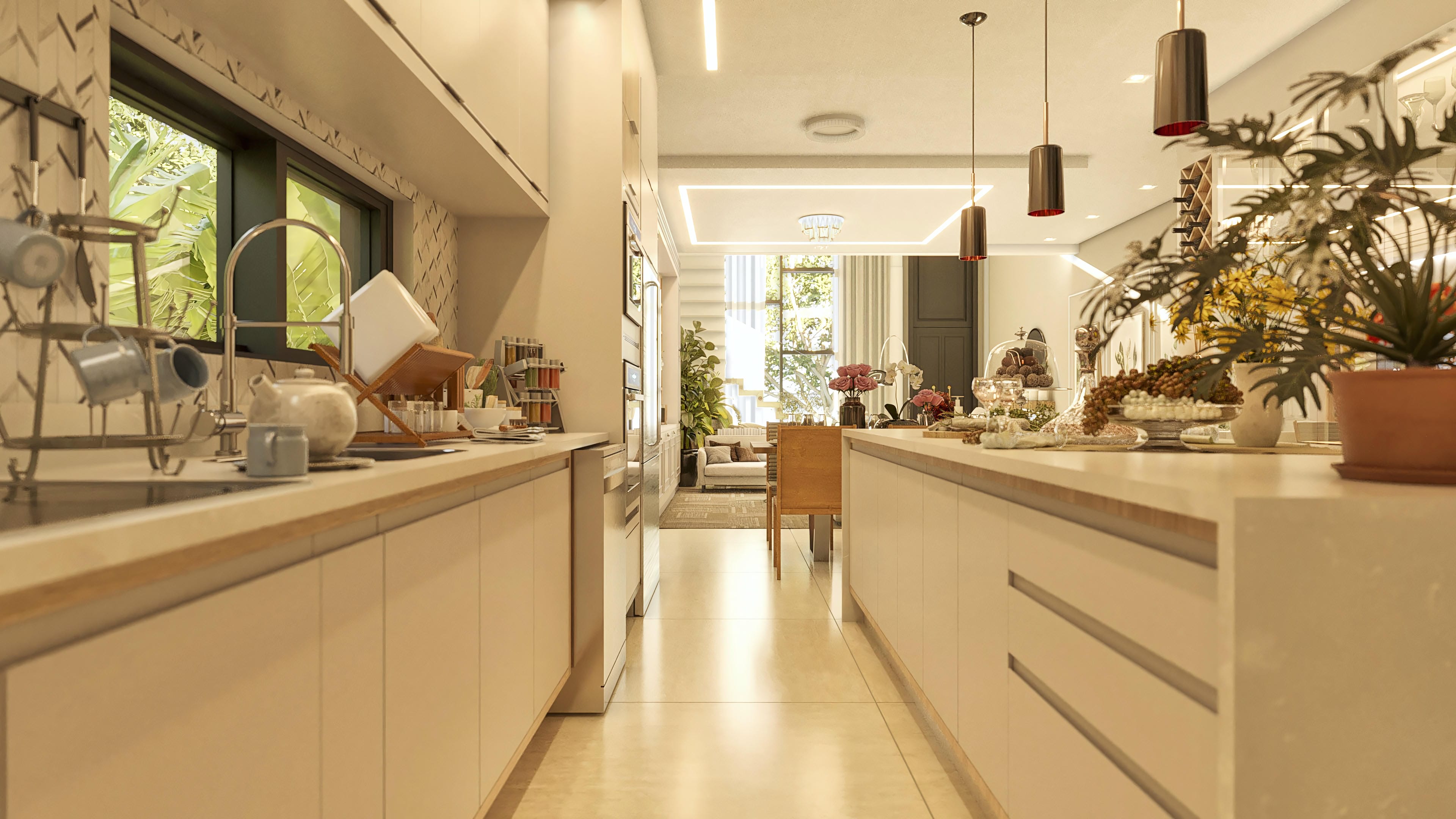 Modern kitchen interior with light cabinets and wide countertops, integrated with a dining room with sophisticated lighting and an external area view.