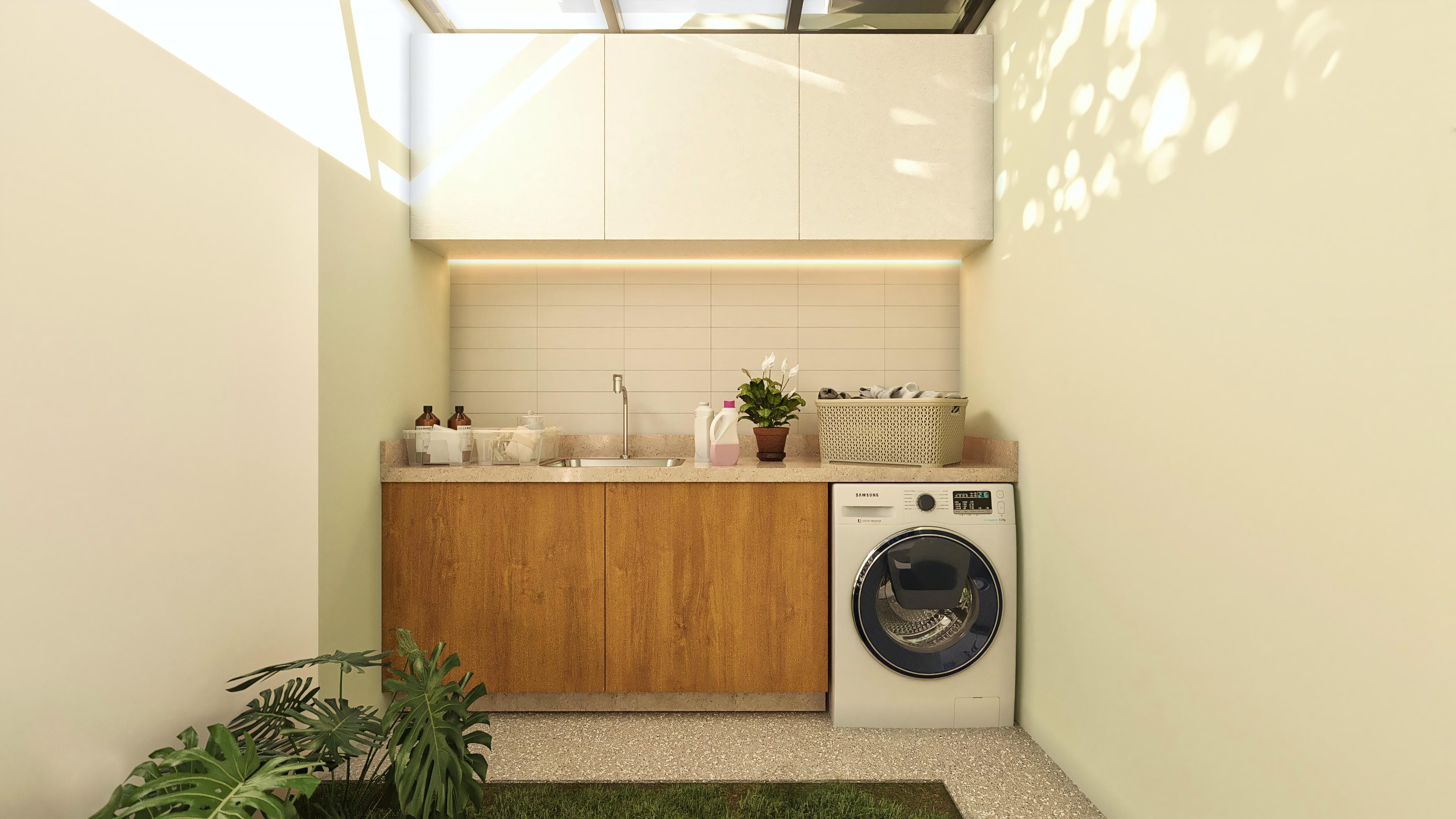 External laundry area with a granite counter, wooden cabinets, utility sink, and a washing machine. Light tile wall and built-in lighting.