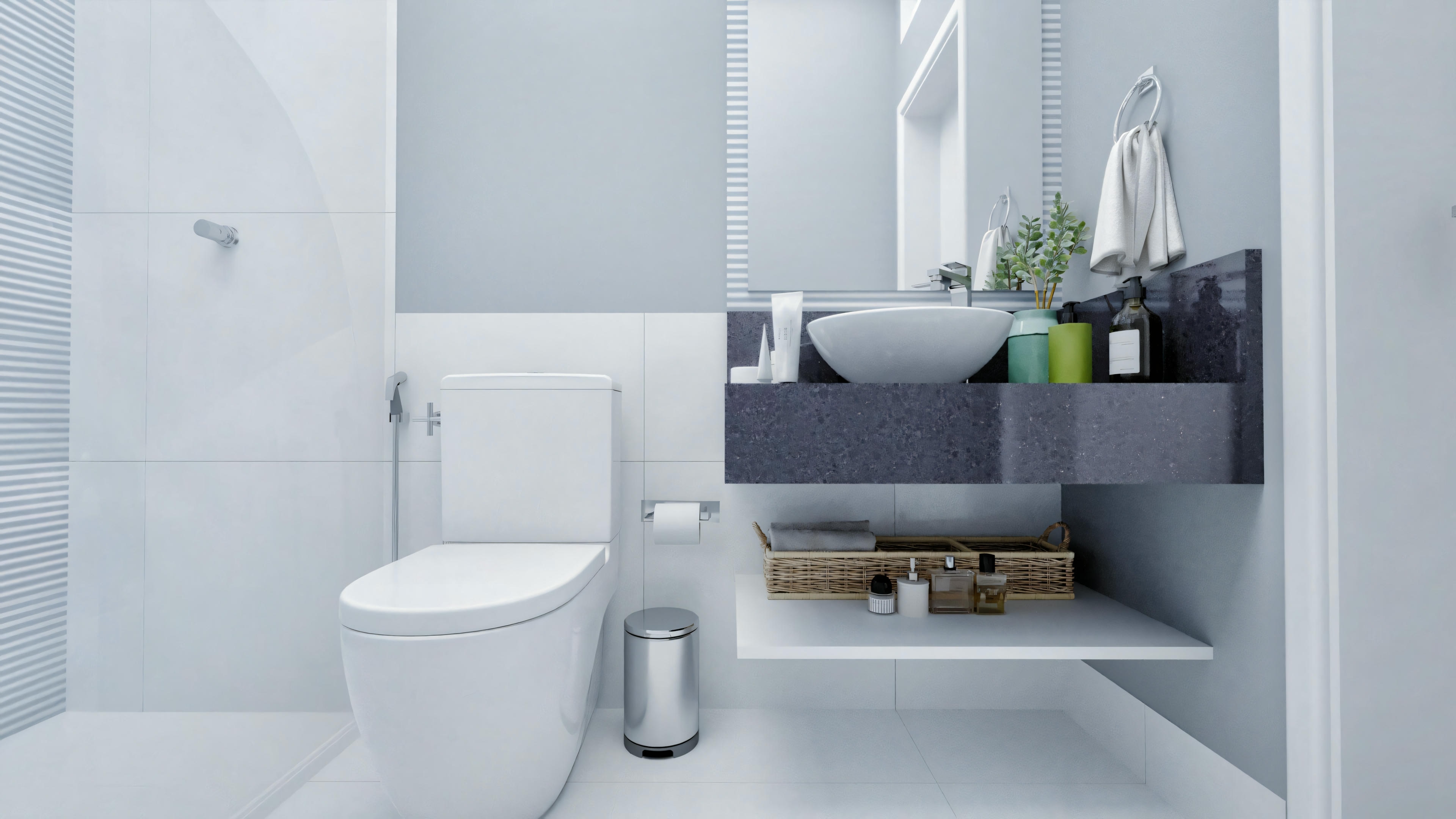 Bathroom with white tones, toilet, sink with storage underneath, and blue towels hanging on the wall.