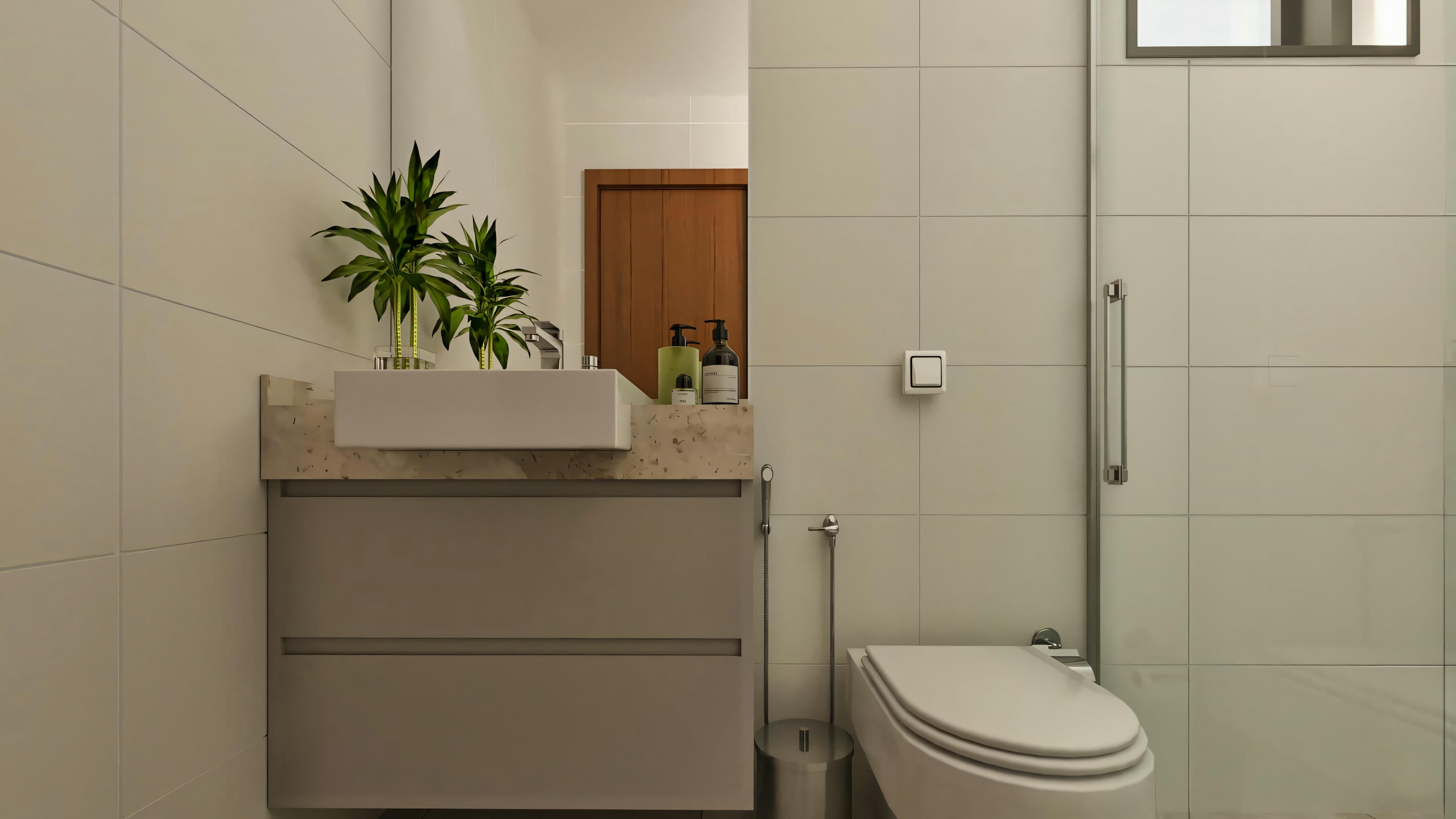 Segundo baño detallado en este proyecto de casa moderna, presentando mesada clara con lavamanos sobrepuesto, mueble suspendido con cajones, inodoro y ducha con mampara de vidrio y perfilería cromada.