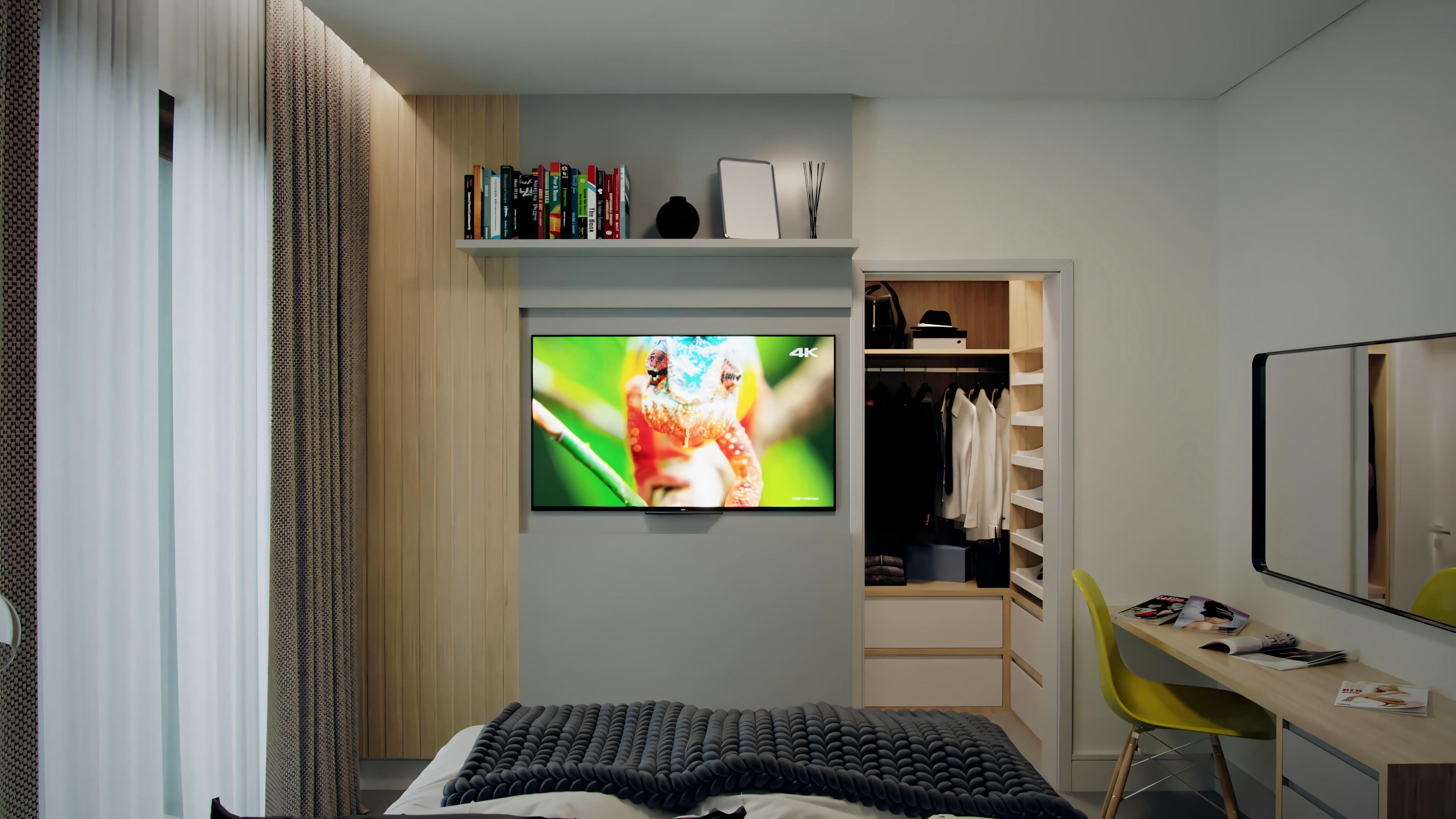 A bedroom with a bed in the foreground and a wall-mounted television displaying colorful images. To the right, an open door leads to another room with visible cabinets, possibly a kitchen or bathroom.