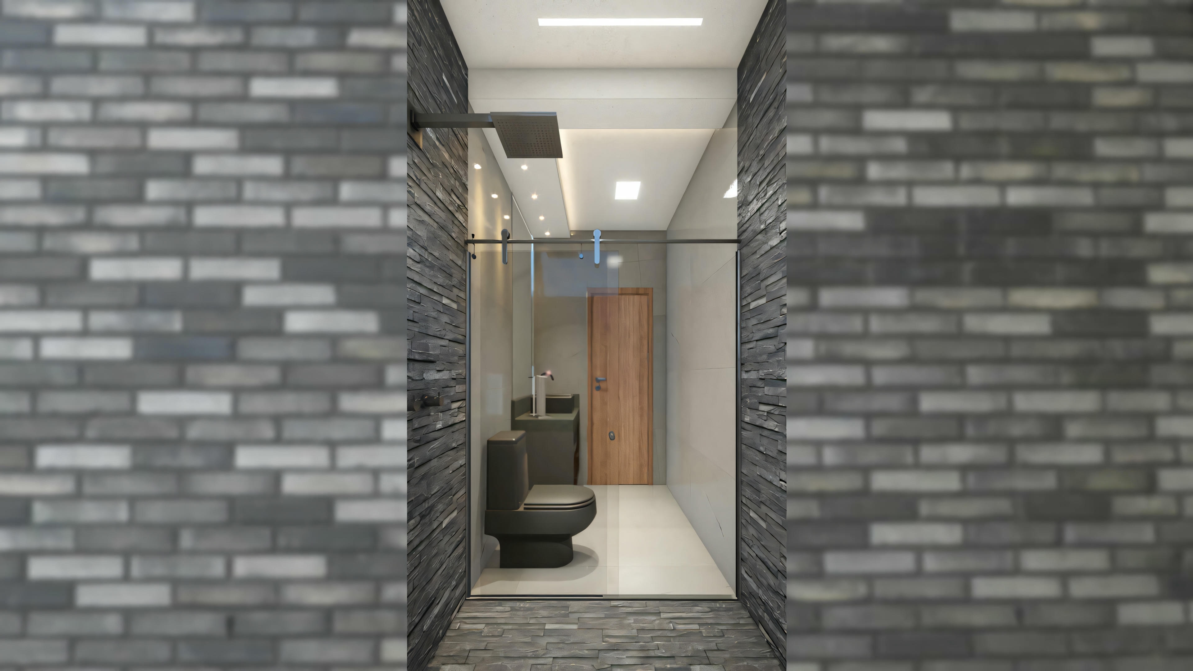 Espaço interior com paredes de tijolos escuros, piso claro e mobiliário moderno, incluindo uma cadeira de escritório preta e uma mesa com equipamentos de computador.