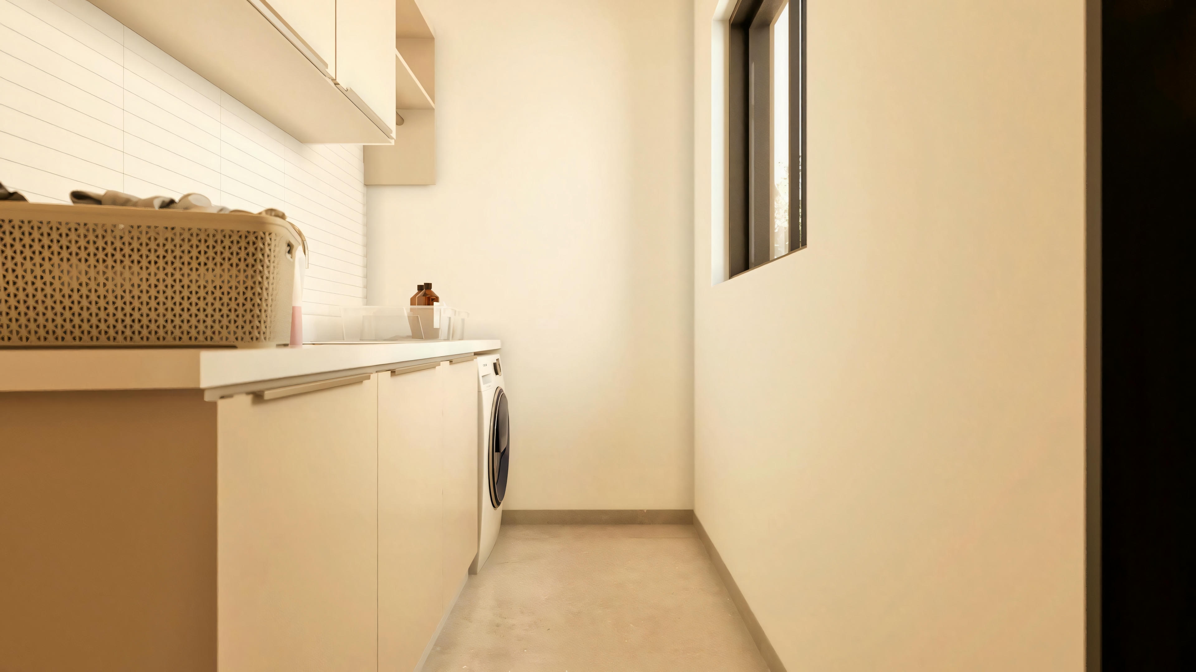 Imagem da lavanderia funcional pertencente ao projeto de sobrado, equipada com armários planejados em tons claros, bancada, máquina de lavar e janela vertical para ventilação e iluminação.