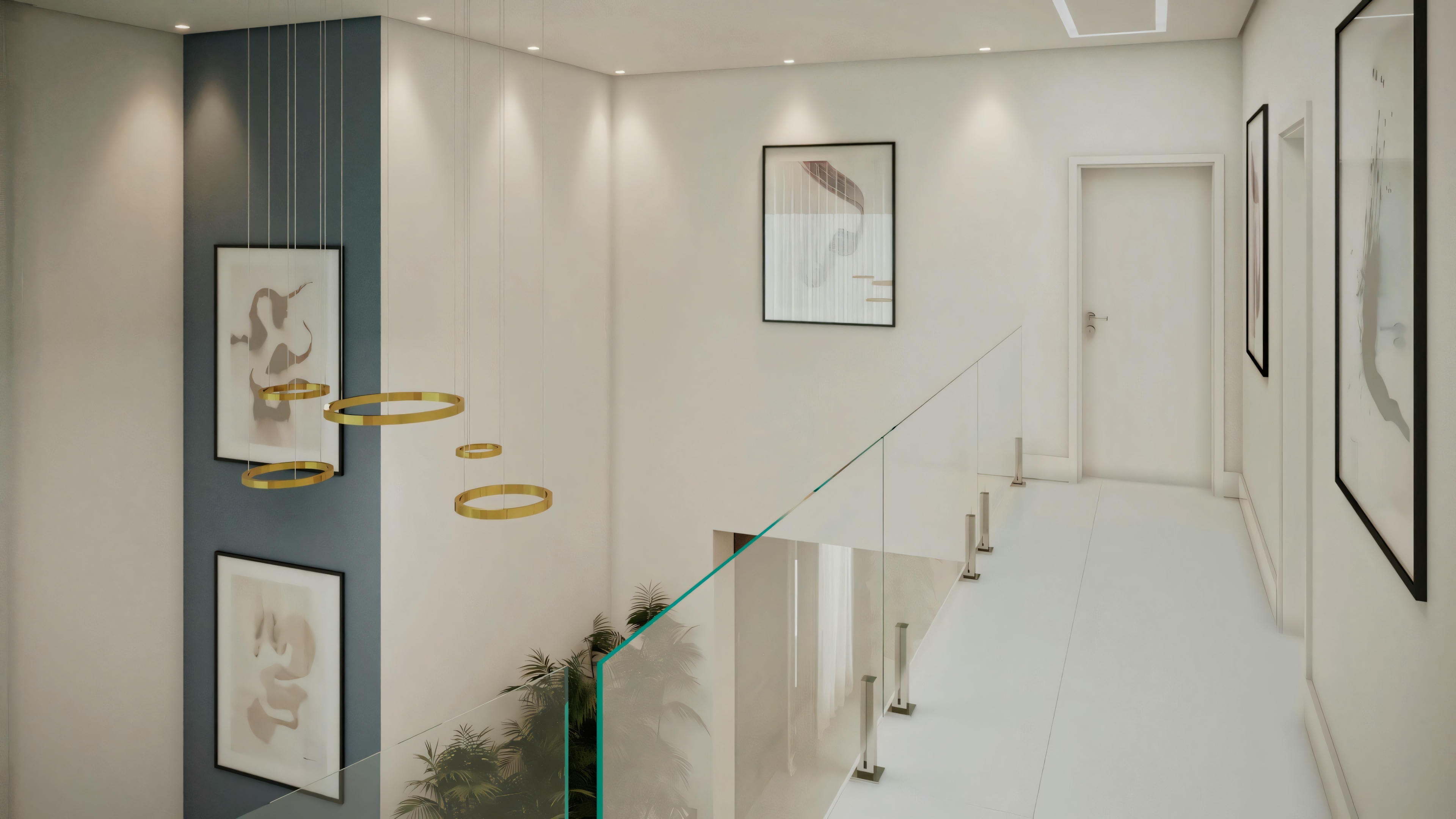 Interior space, likely a hallway, with a curved design. To the left, framed pictures are on the wall, and a decorative plant is on a stand. To the right, a staircase with a handrail leads to another level.