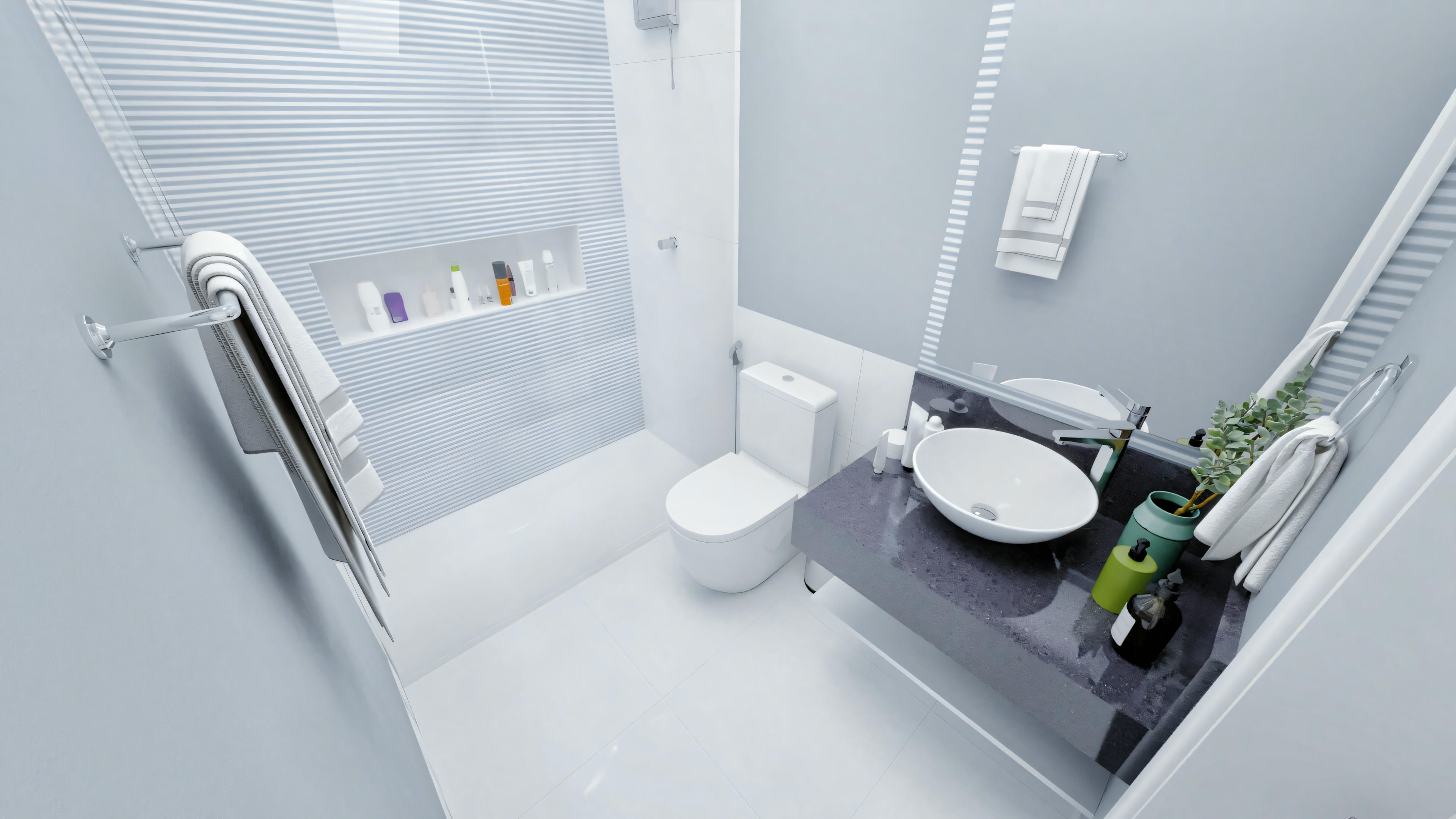 Un baño moderno con paredes blancas, inodoro, lavabo con espejo encima y área de ducha con puertas de vidrio. Hay toallas colgadas en la pared y algunos artículos de tocador cerca del lavabo.