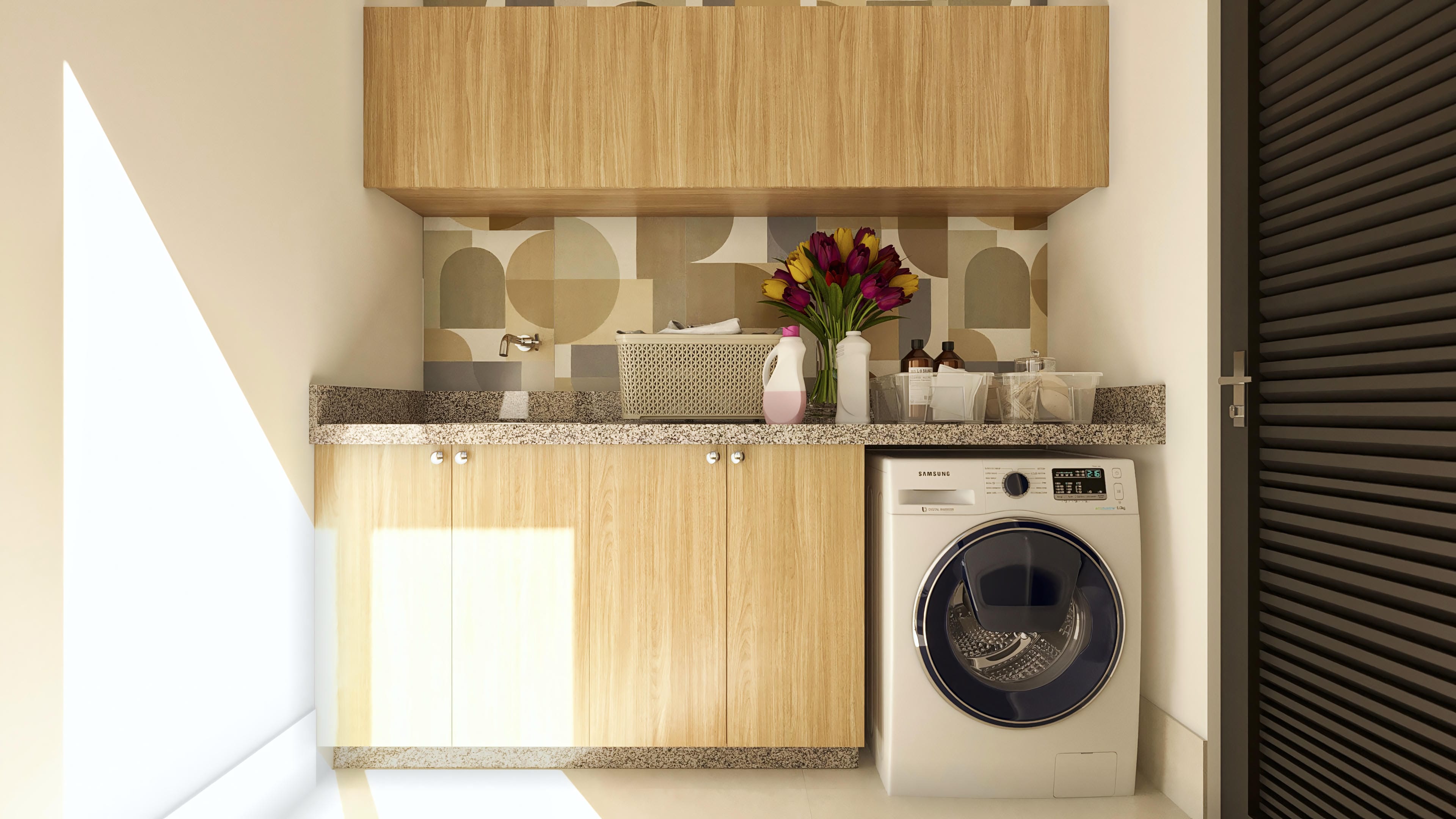 Laundry detail with light wood cabinets, granite-topped counter, chrome sink, and modern front-load washing machine.