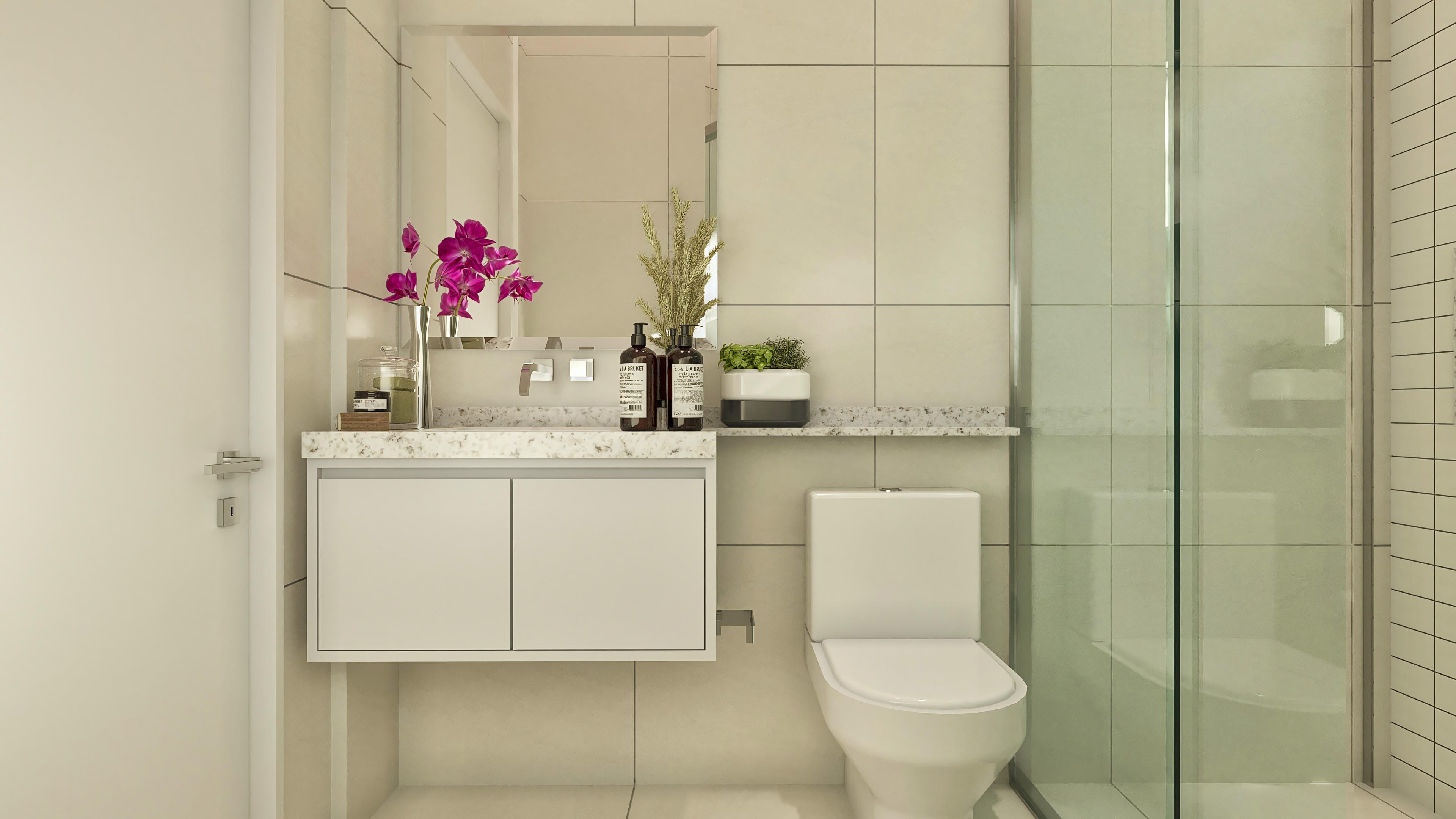 Detail of a bathroom with travertine marble countertop, sculpted sink, mirror with built-in lighting, and a tempered glass shower stall with a decorative niche.