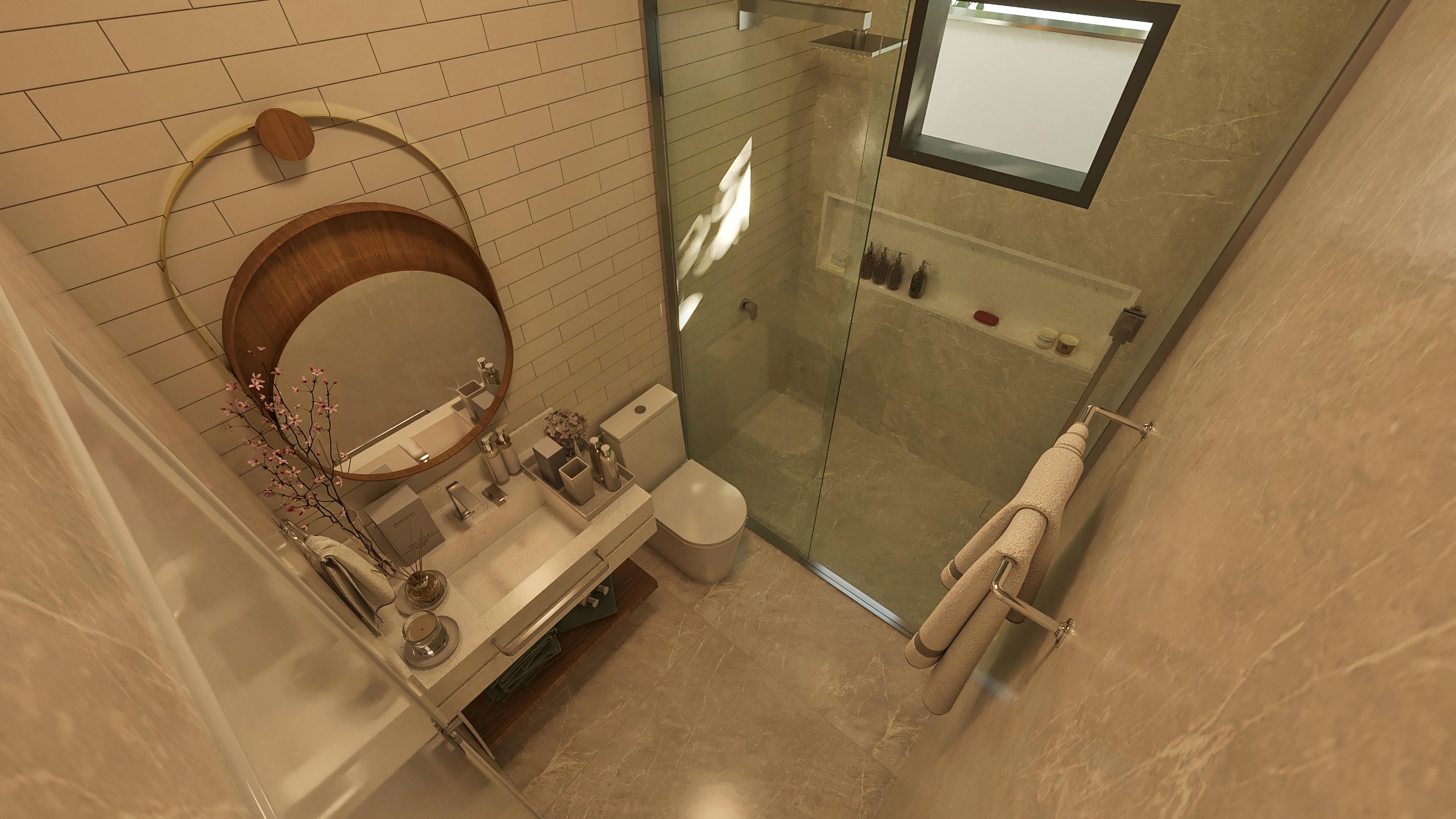 Detalle de baño moderno con encimera en porcelanato, espejo redondo con marco de madera y mampara de vidrio con ducha.