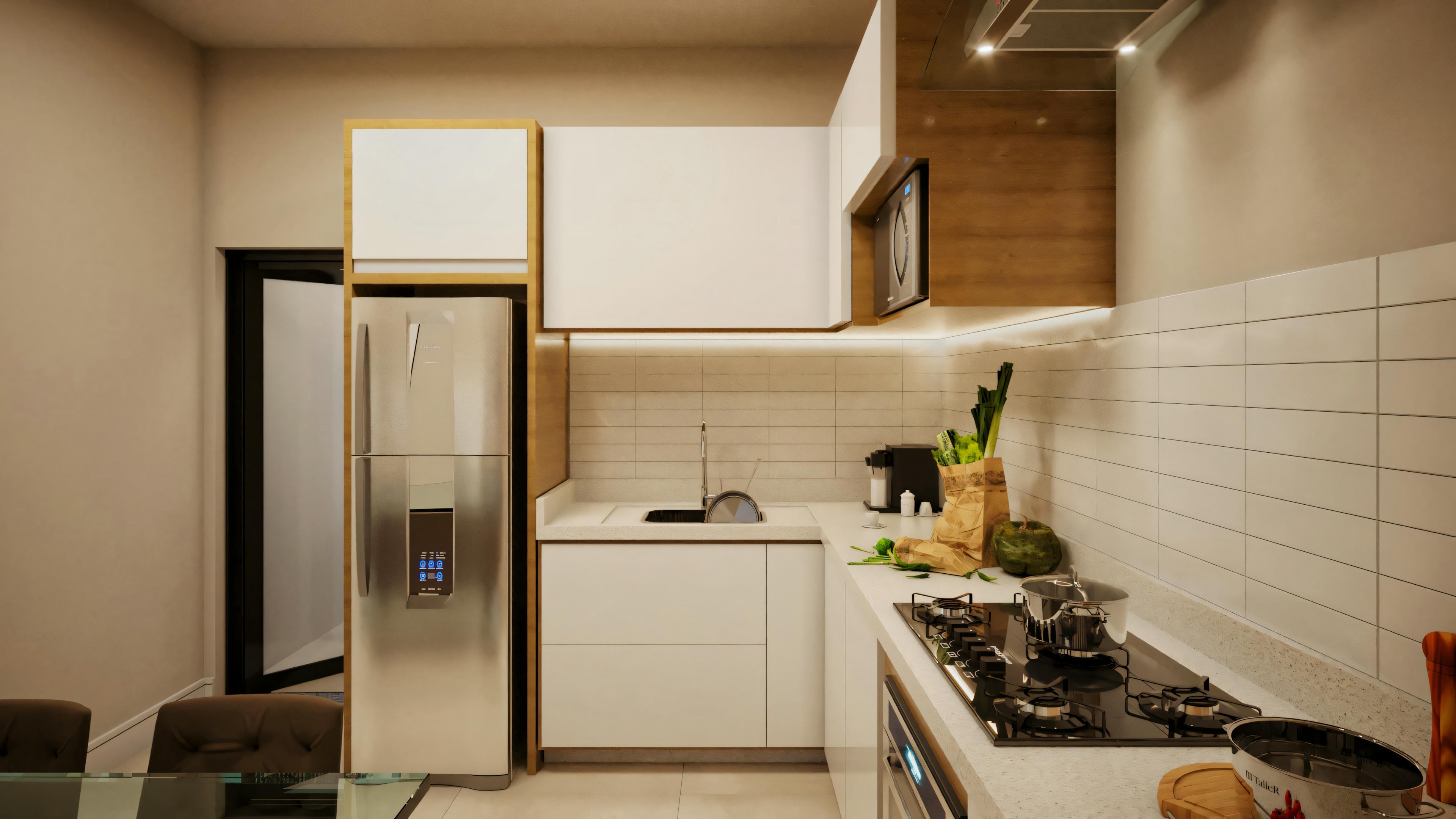 Cocina moderna con gabinetes blancos, refrigerador y área de preparación con frutas en la encimera.