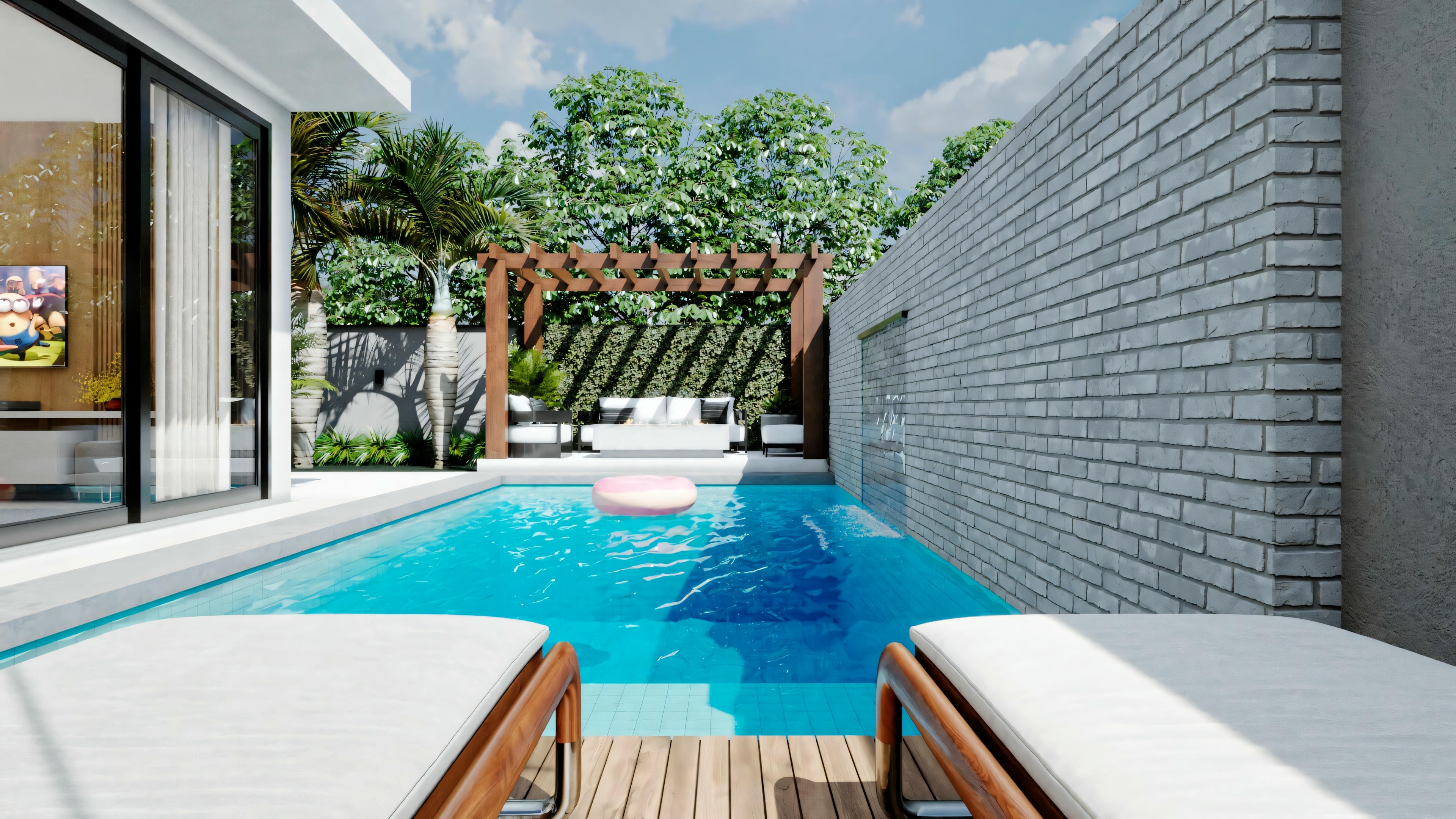 Un espacio al aire libre moderno con piscina, área de estar y vegetación alrededor.