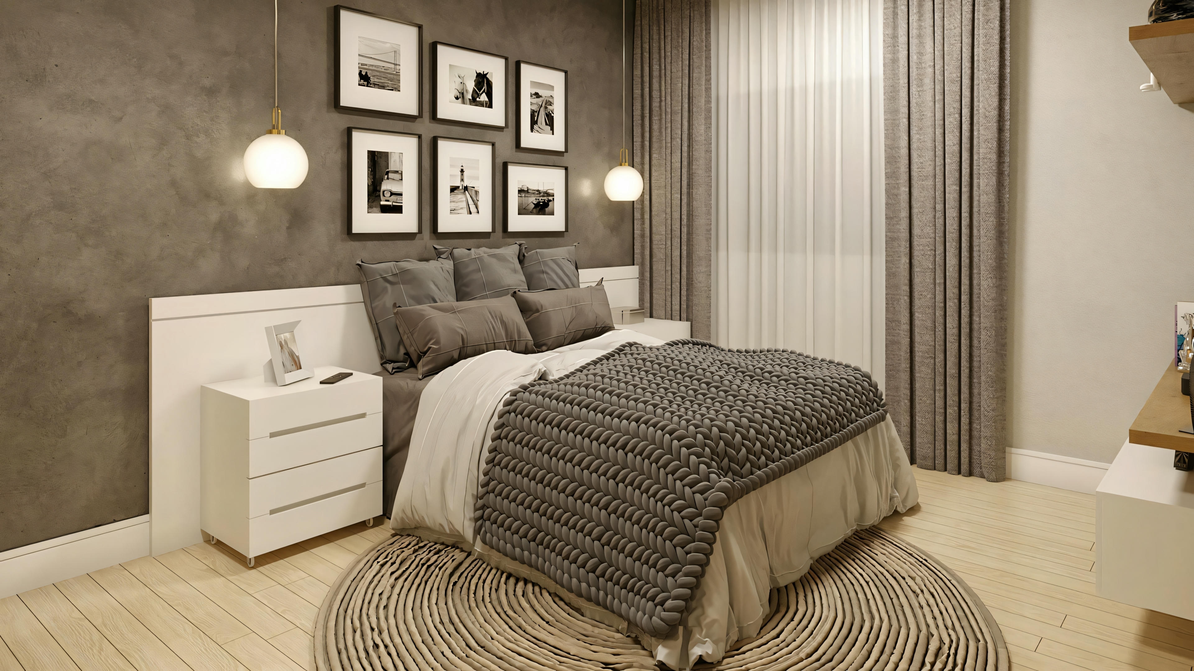 Habitación con cama con colcha de rayas grises, lámparas de pared y cuadros encima del cabecero.