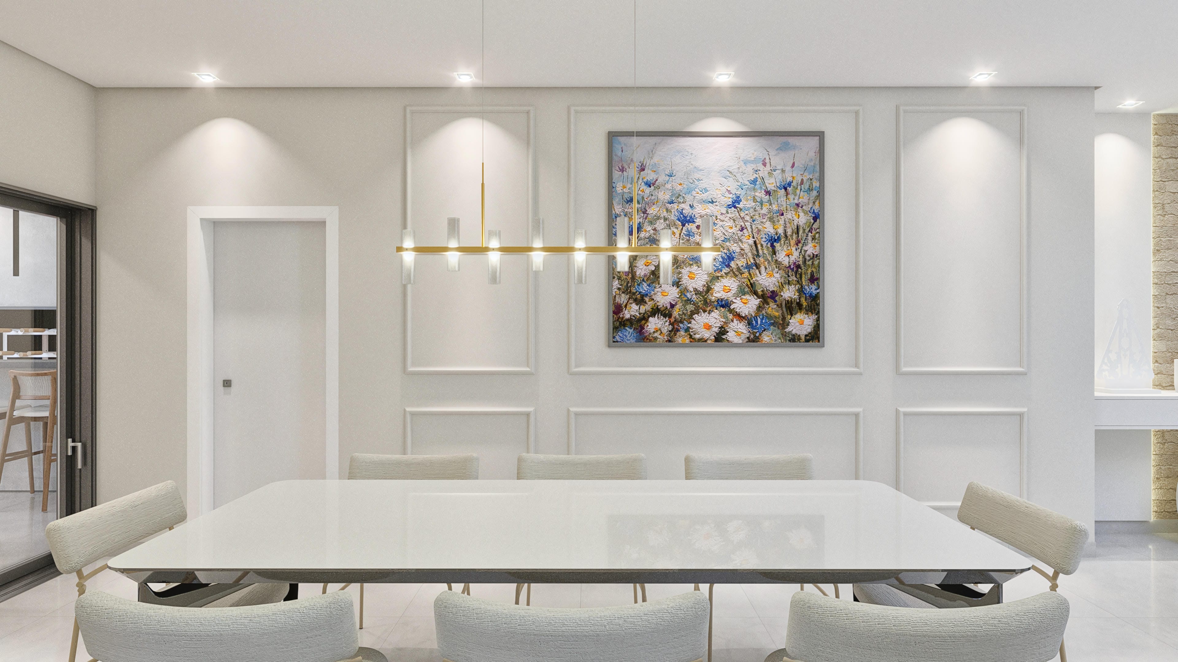 Ambiente interior de una residencia lujosa con mesa de comedor moderna, sillas confortables e iluminación planificada. Una pintura de flores vibrantes decora la pared.