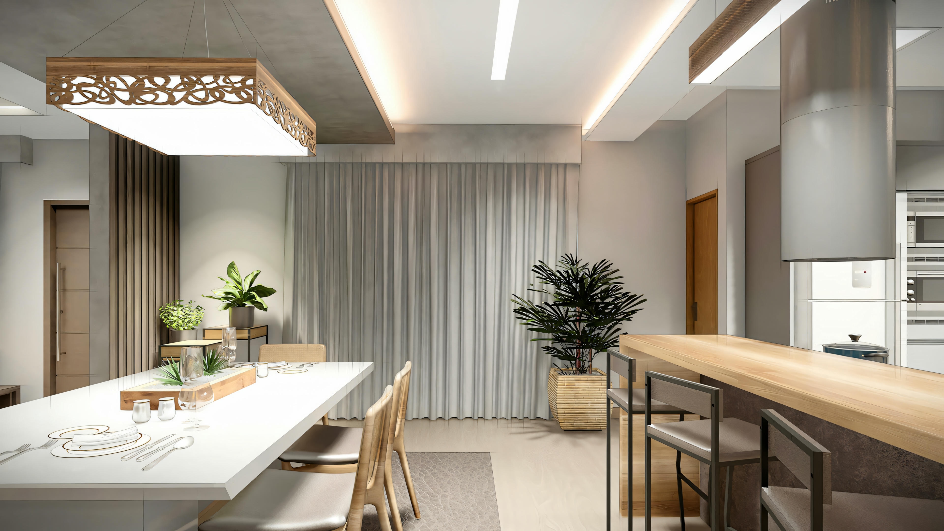 A dining area with a table for four and an open kitchen in the background.