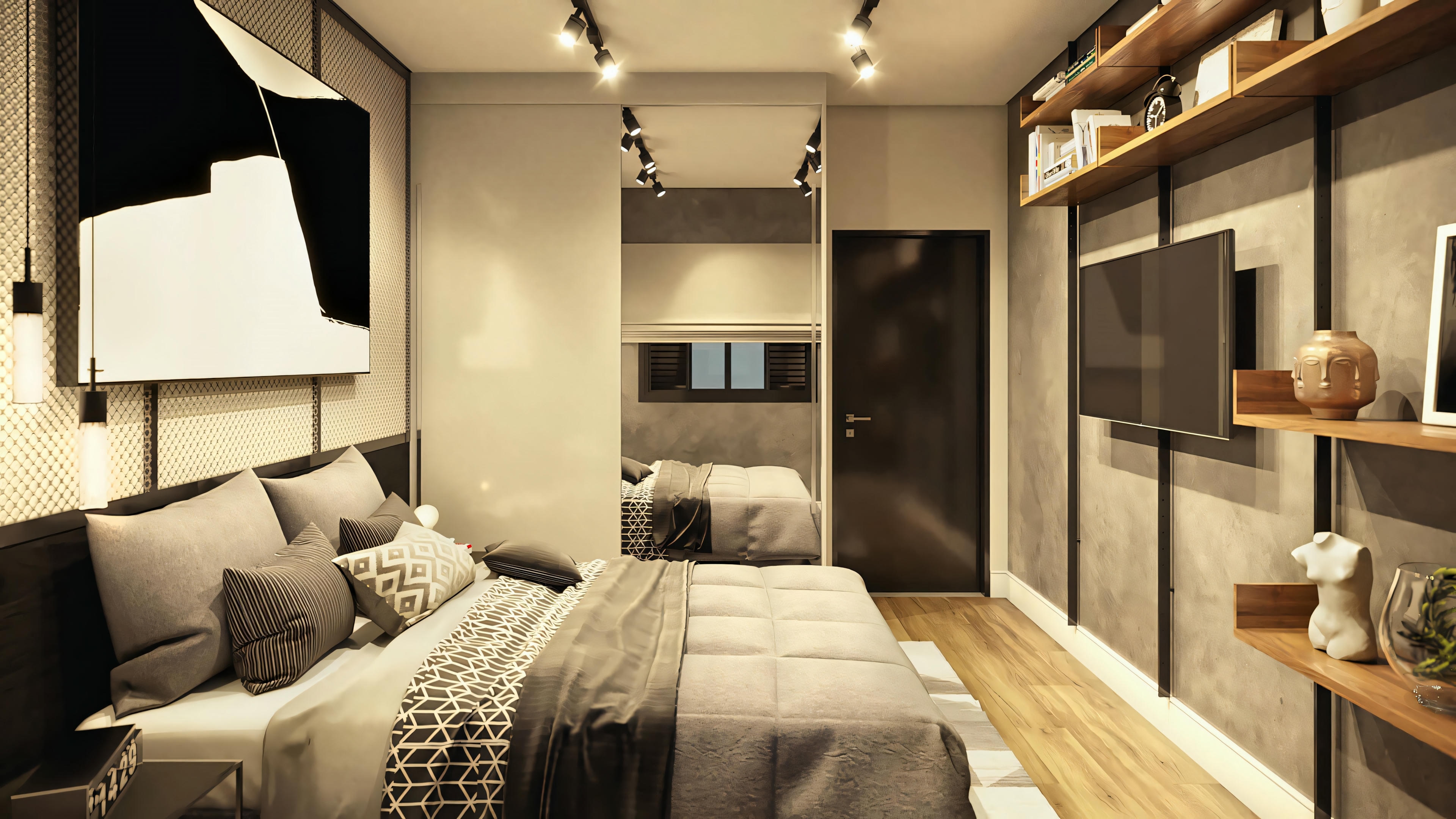 Dormitorio moderno con cama grande, zona de estar a los pies de la cama e iluminación cálida.
