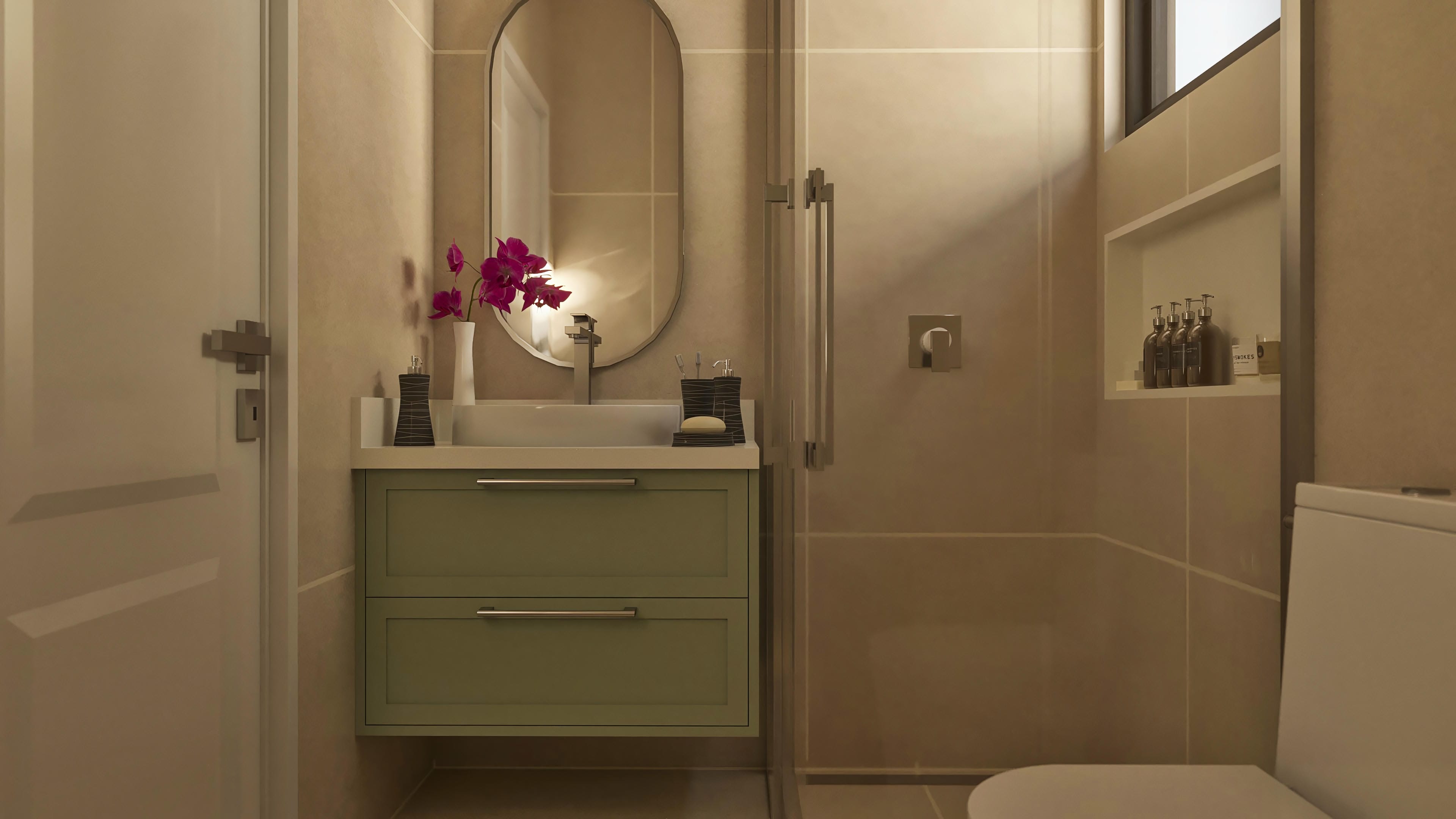 Interior de un lavabo moderno con encimera verde, espejo ovalado y lozas blancas, destacando la elegancia y funcionalidad.