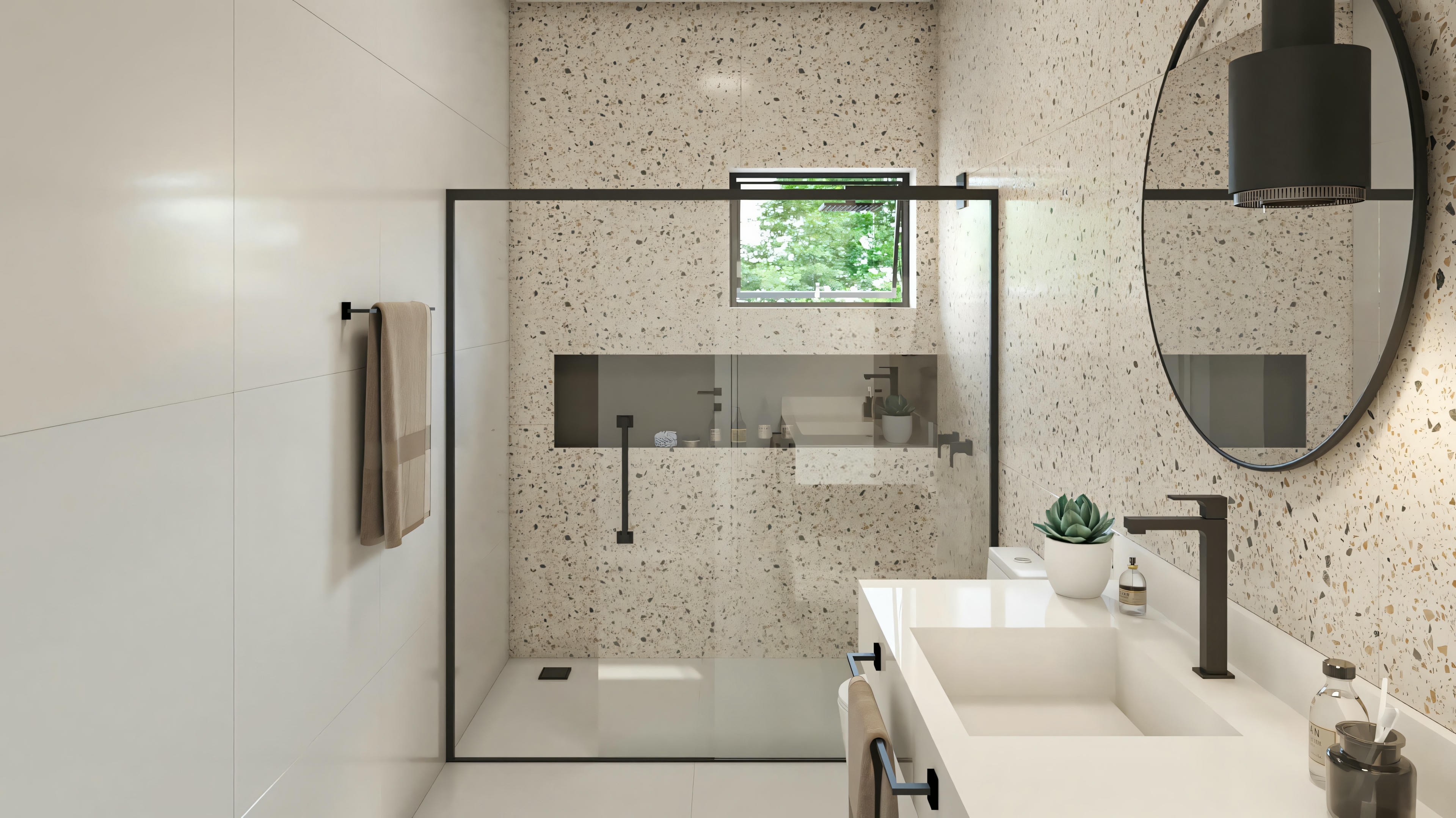 Bathroom with a shower area visible through a glass partition, a towel rack with towels, and a round mirror above the sink.