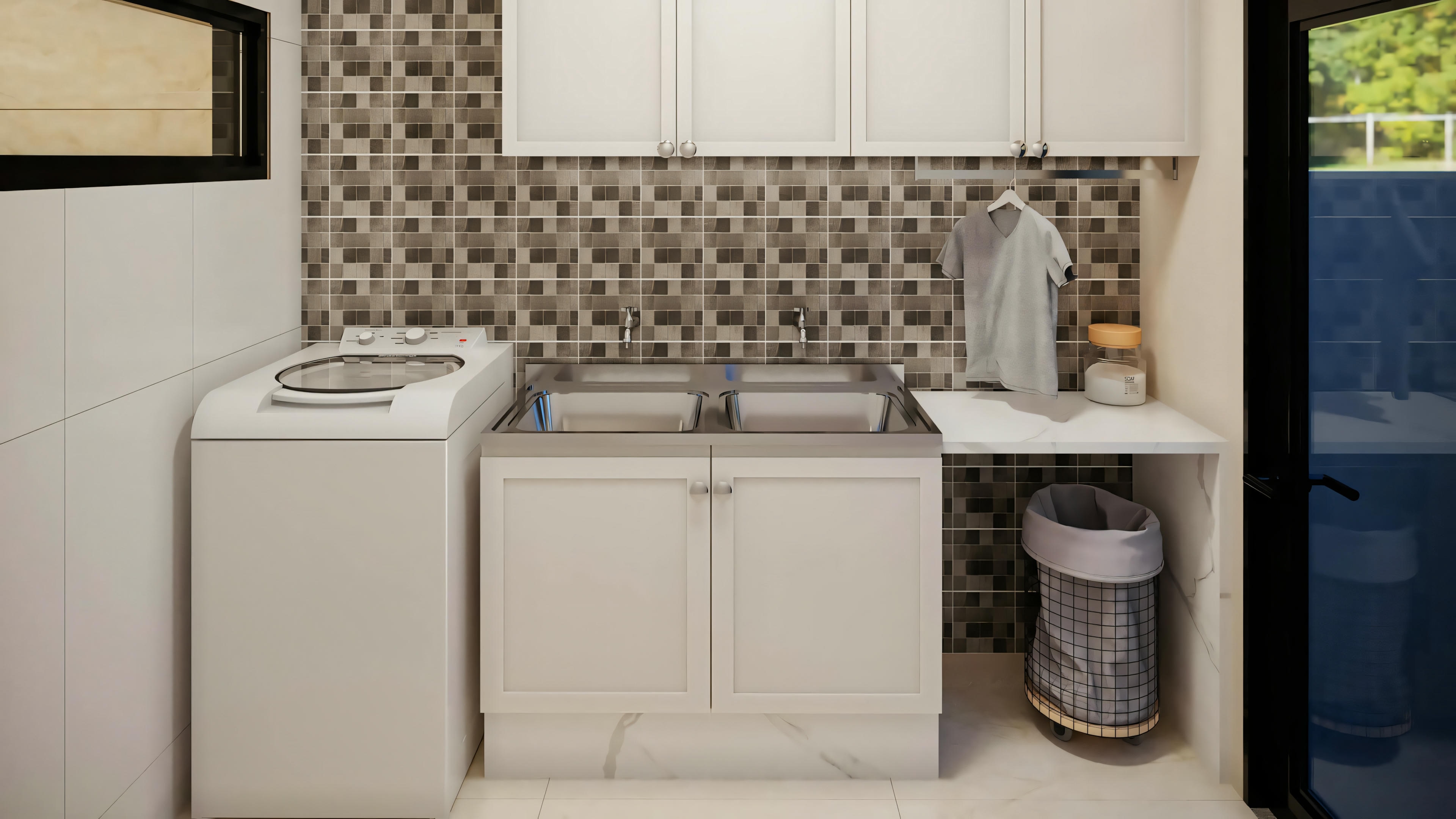 A laundry room with a washing machine, sink, and cabinets. There is also a patterned backsplash and a trash can on the right.