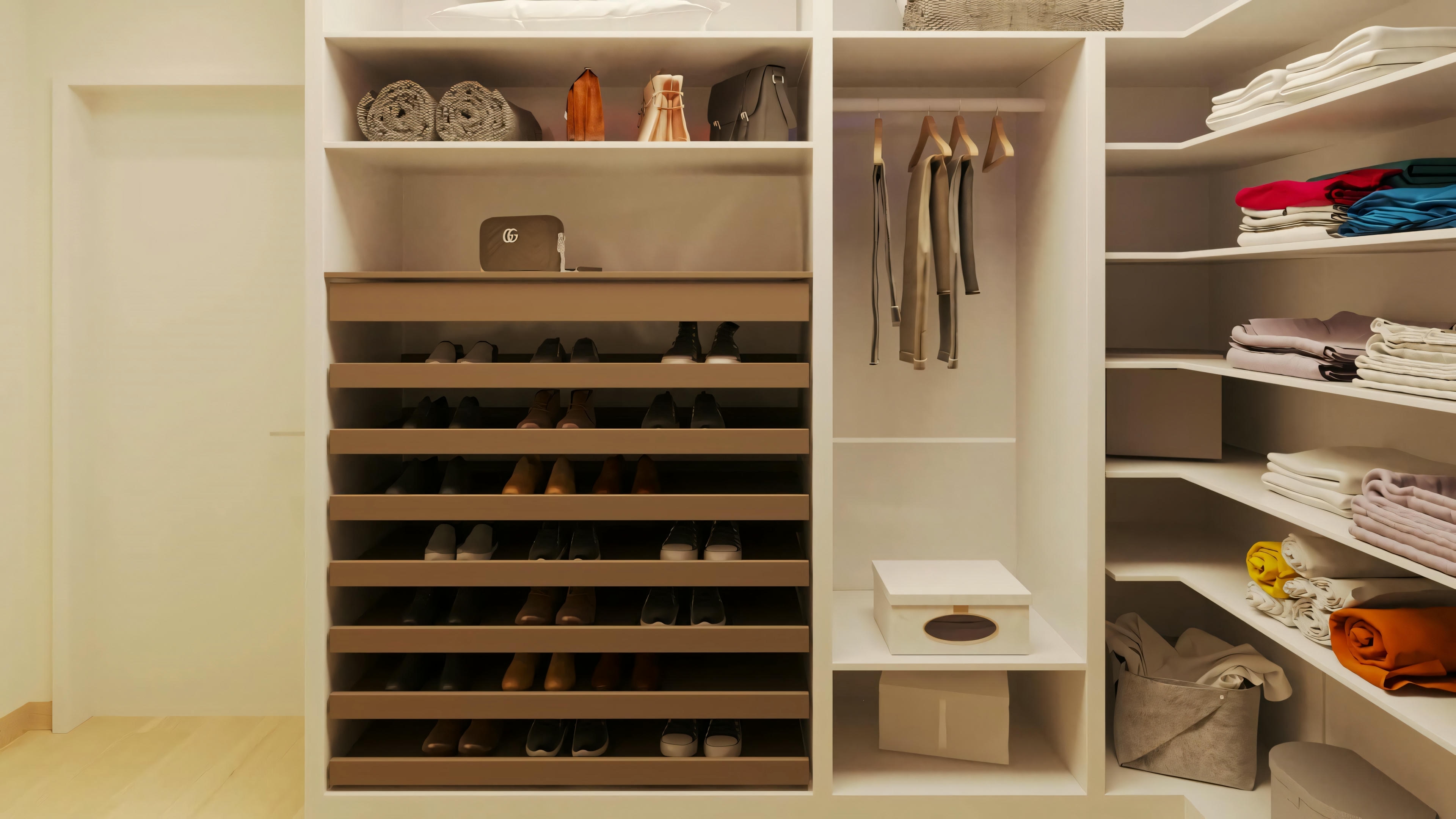 Detail of the closet in one of the 5 suites of the ready-made project, showing sliding shelves for shoes, hanging rod, and white organizing niches.