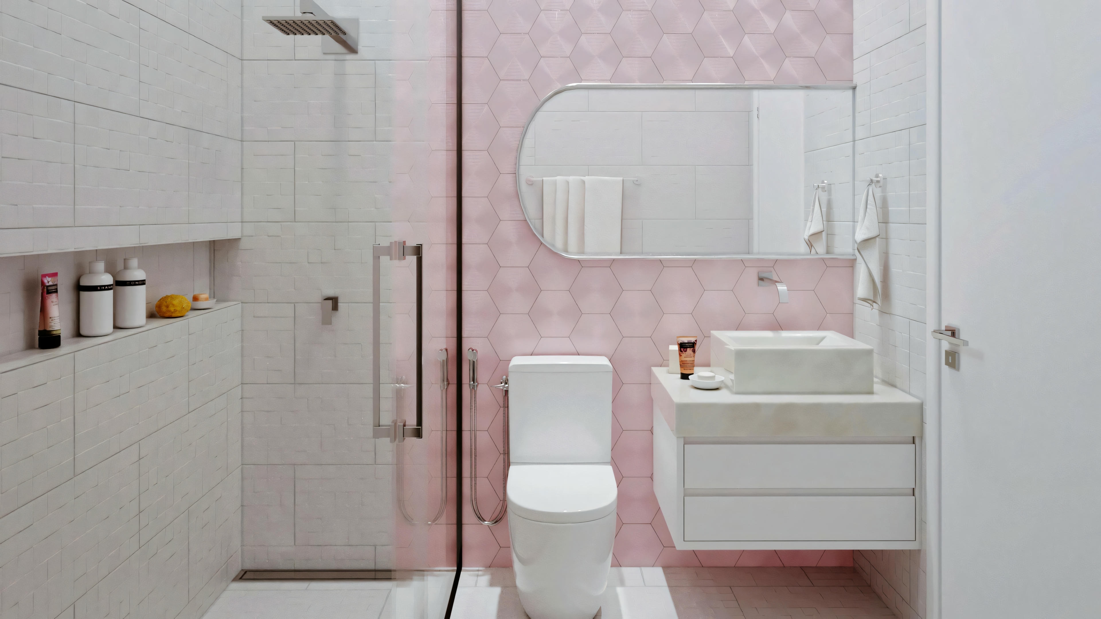 A bathroom with pink tiles, a pedestal sink, and a round mirror.