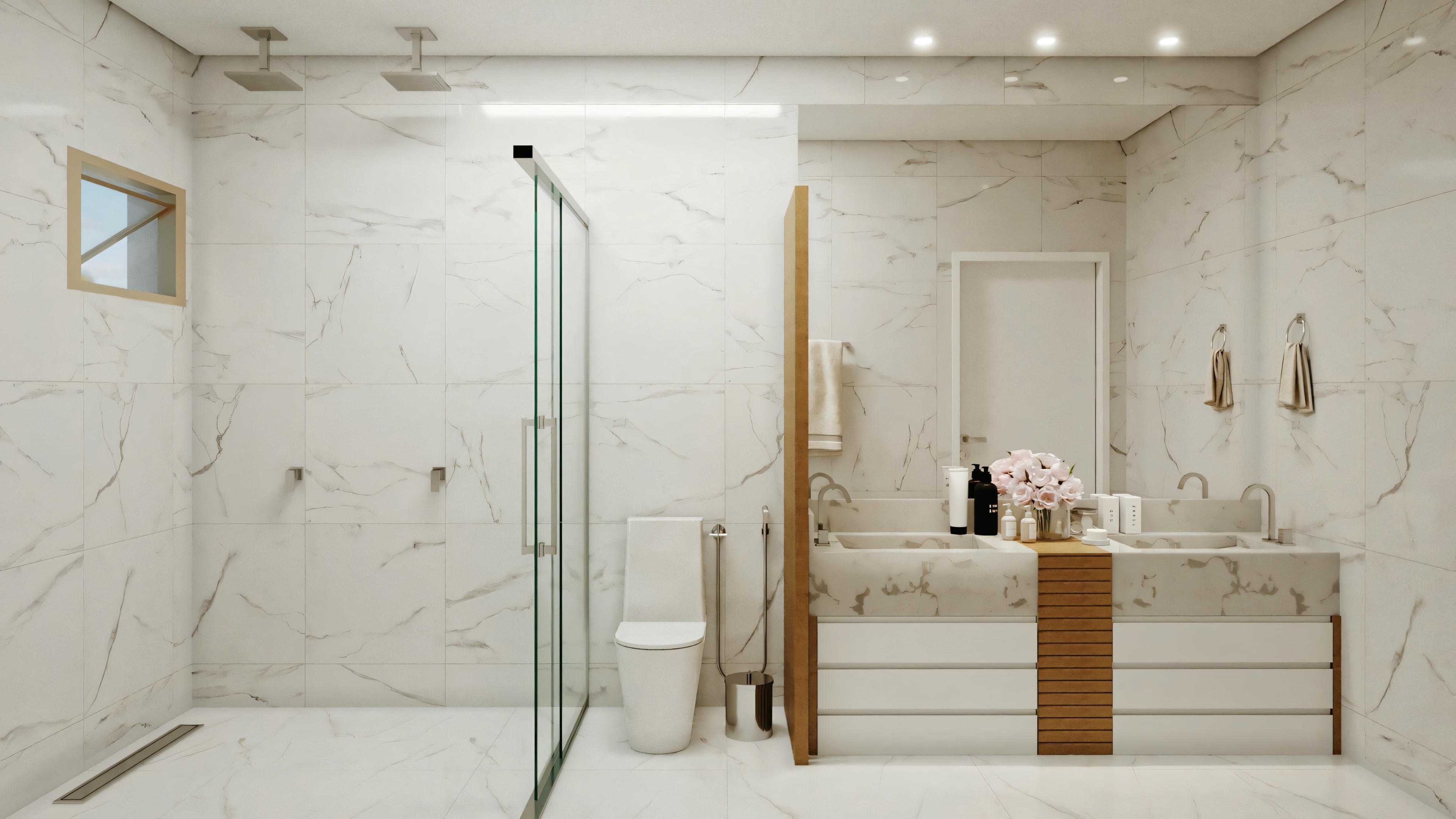 A bathroom with a glass shower enclosure, wooden countertop with two sinks, and beige-toned walls and floor.