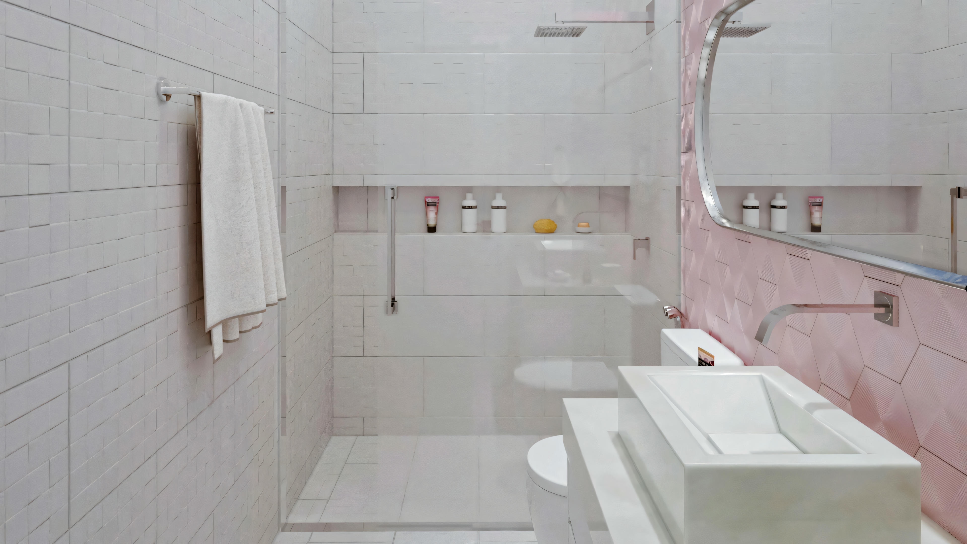 A bathroom with pink tiles and a white bathtub.