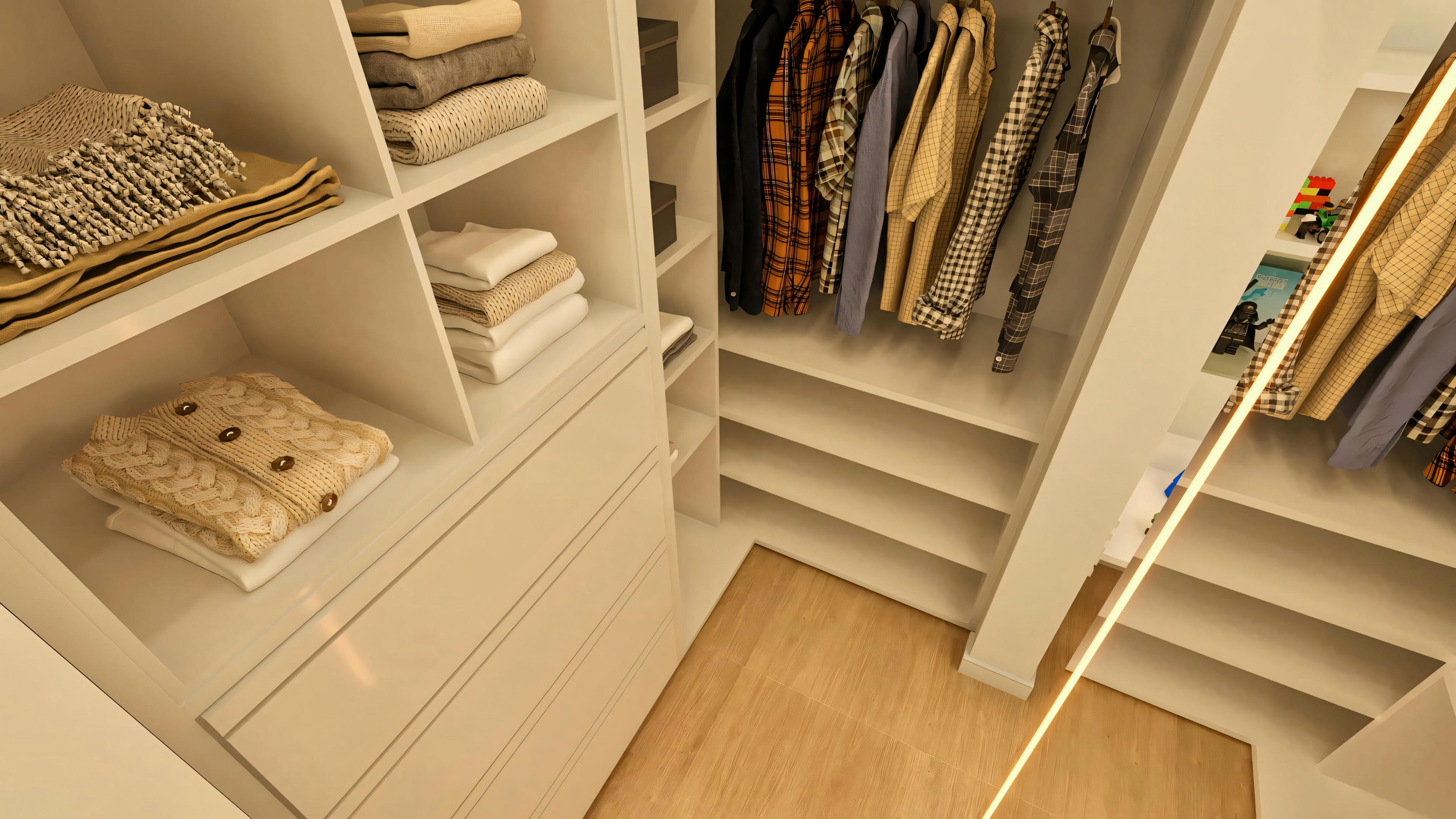 Vista superior do walk-in closet em suíte de casa de luxo, exibindo armários planejados brancos, piso amadeirado e roupas organizadas.