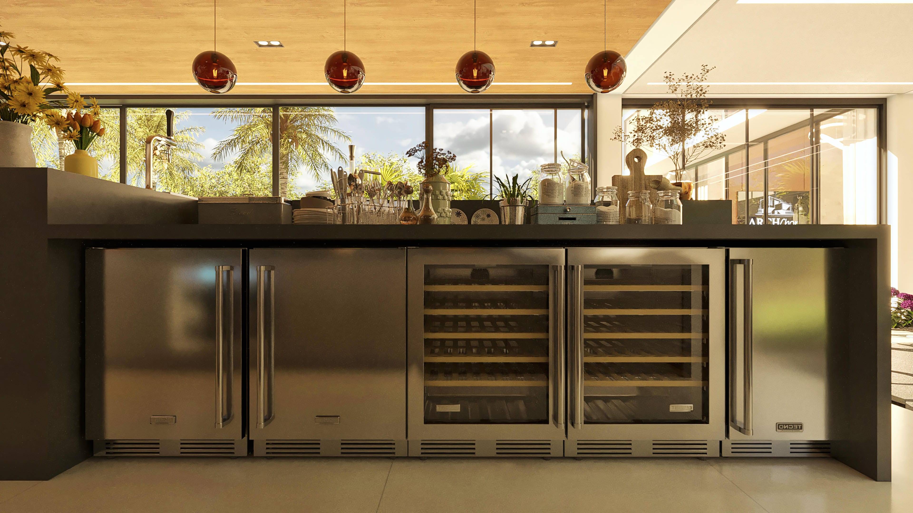 Detalhe da área gourmet de um sobrado moderno, com armários em inox, adegas climatizadas e bancada com vista para área externa.