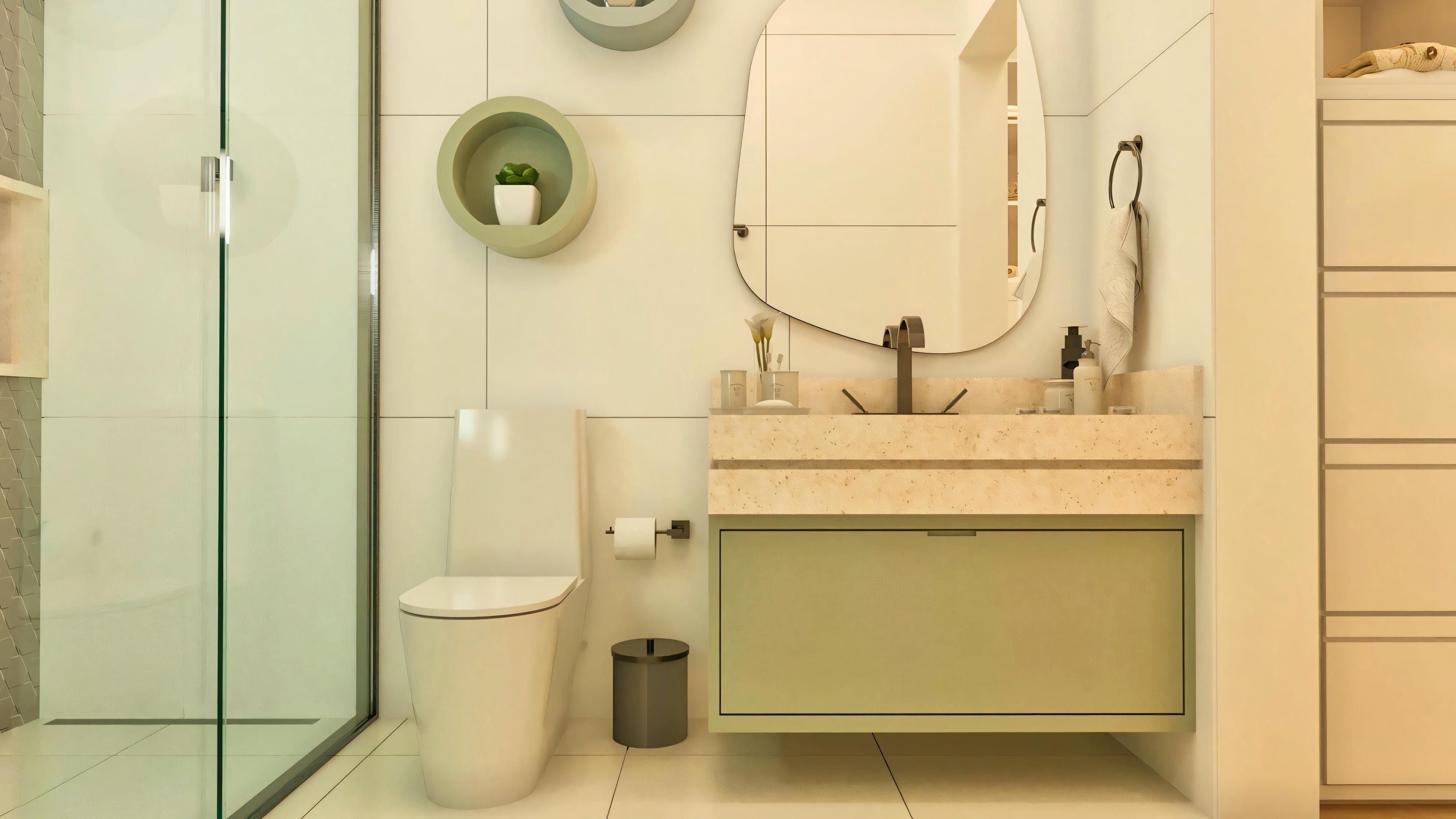 Modern bathroom in a luxury house suite, with a floating stone countertop, organic mirror, glass shower enclosure, and light cladding.