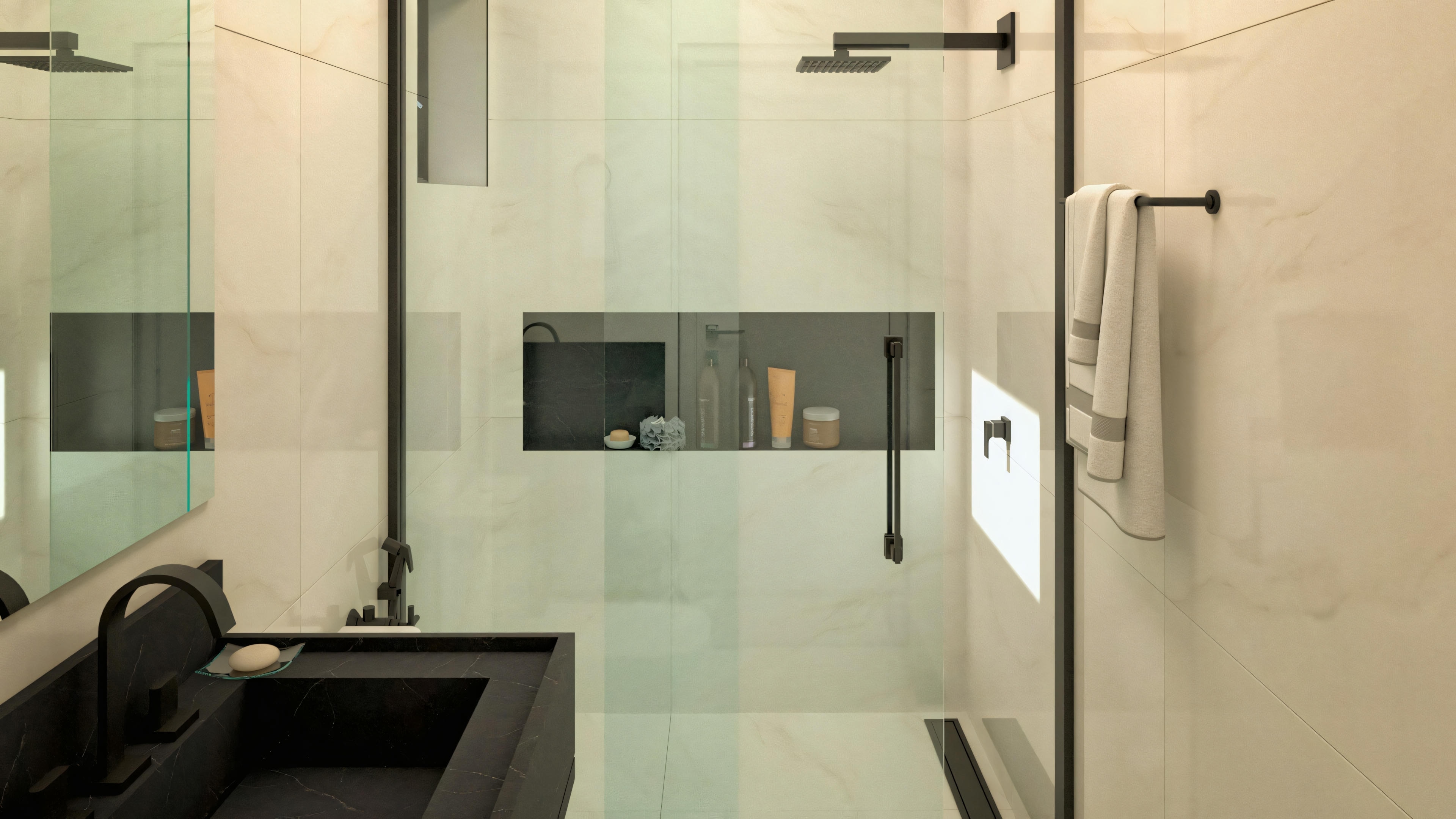 A modern bathroom with neutral tones, featuring a glass shower enclosure.