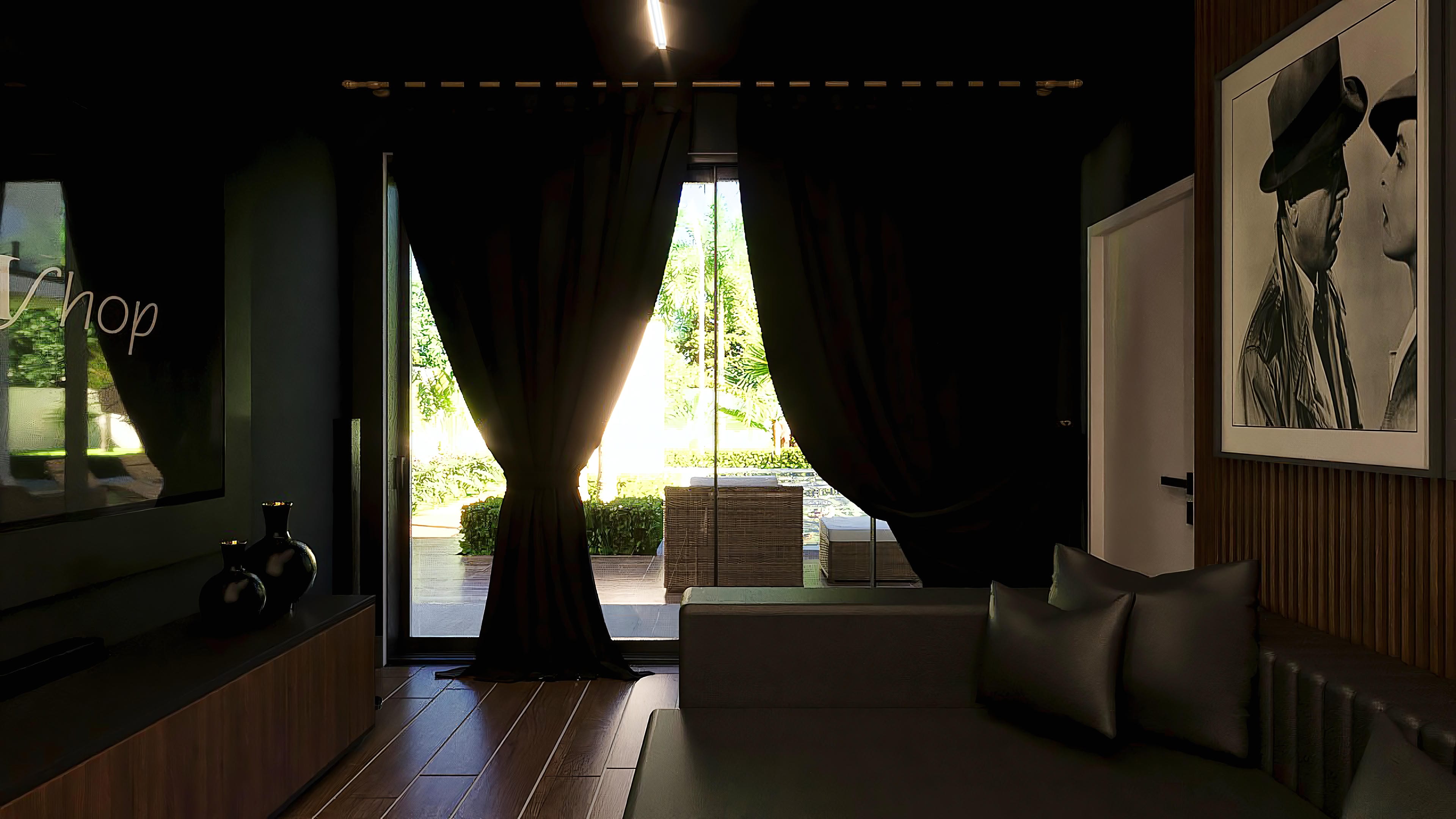 Elegant interior of a neoclassical two-story house, with dark wood floors and sophisticated furniture. The lighting highlights artwork and a view of the outdoor area with a pool.