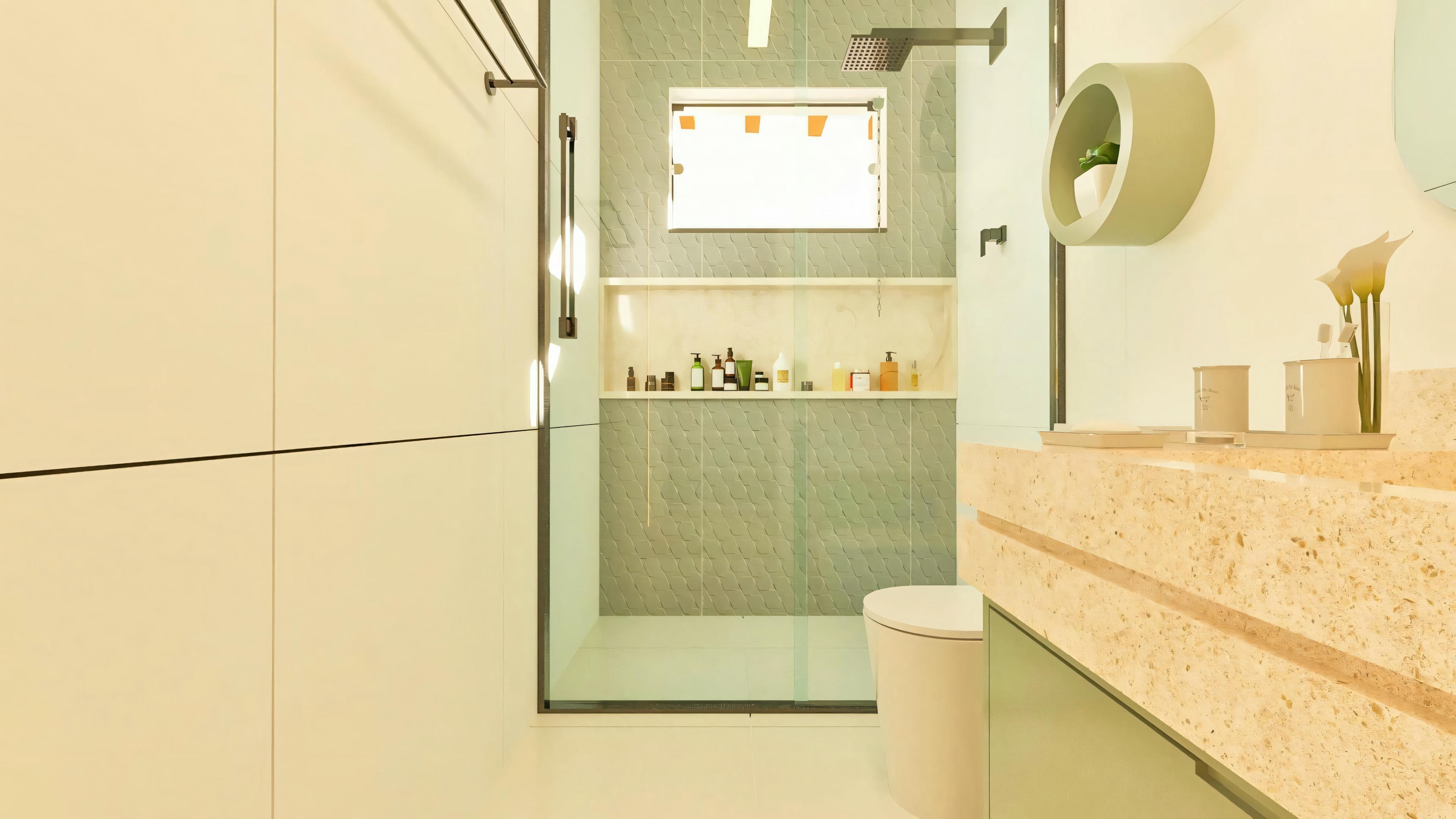 View of the suite bathroom in a luxury house, detailing the shower area with a built-in niche, textured cladding, and modern showerhead.