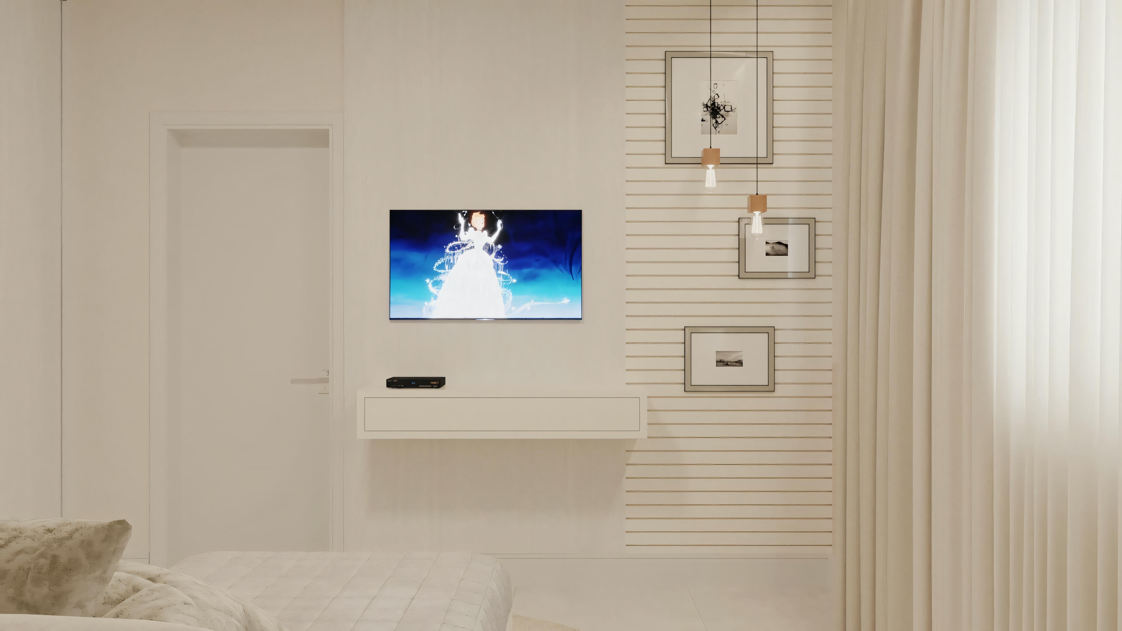 Una sala de estar con sofá y televisor montado en la pared.