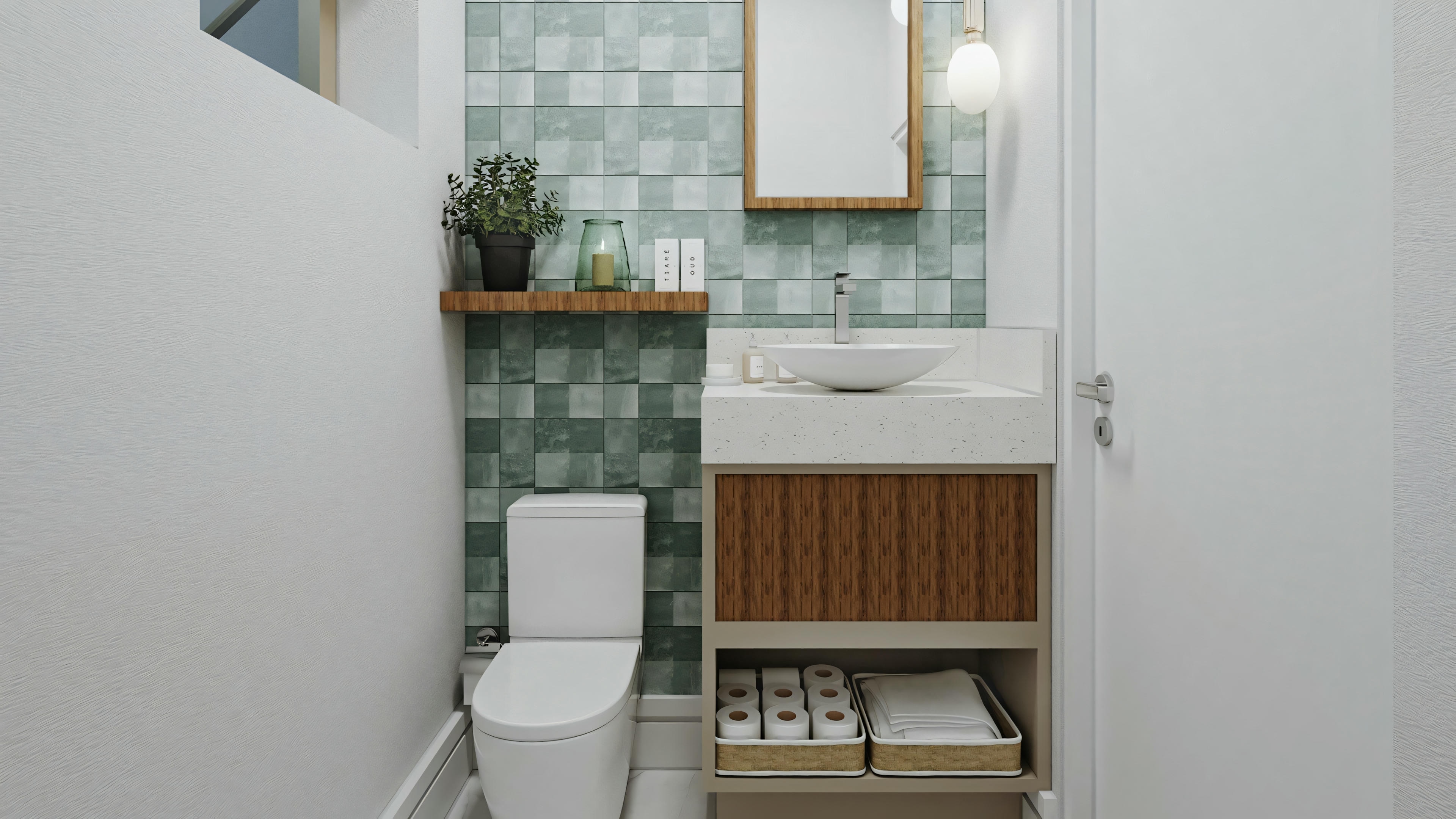 Un baño con paredes blancas, inodoro y lavabo con azulejos de patrón azul en la pared detrás de él.