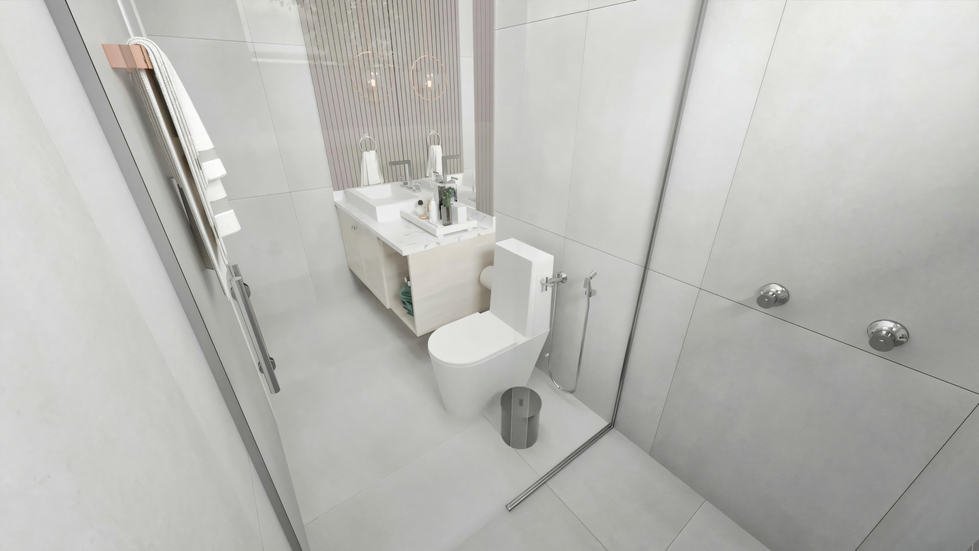 Bathroom with a shower area visible through a glass partition, toilet, and towels hanging on the wall.